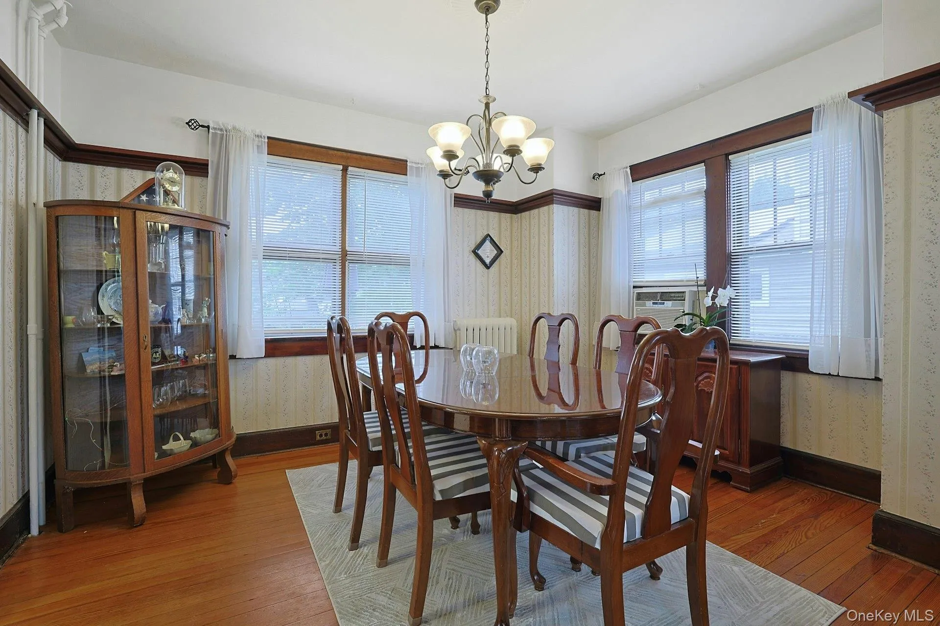 The light-filled dining room provides a comfortable space for everyday meals and entertaining, with walls of windows on two sides. The light-filled dining room provides a comfortable space for everyday meals and entertaining, with walls of windows on two sides.