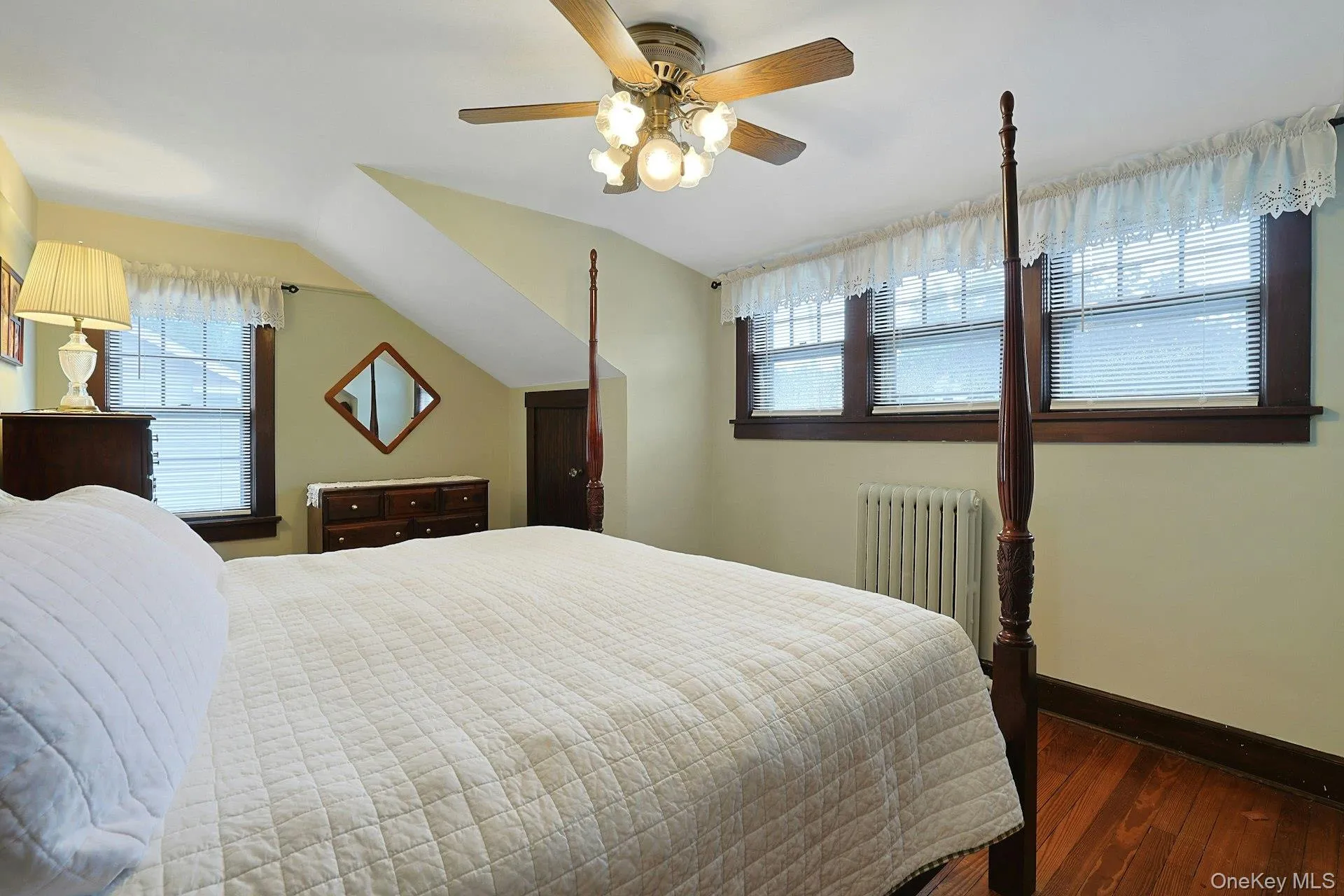 Light-filled primary bedroom showcasing beautiful wood craftsmanship and plenty of windows. Light-filled primary bedroom showcasing beautiful wood craftsmanship and plenty of windows.