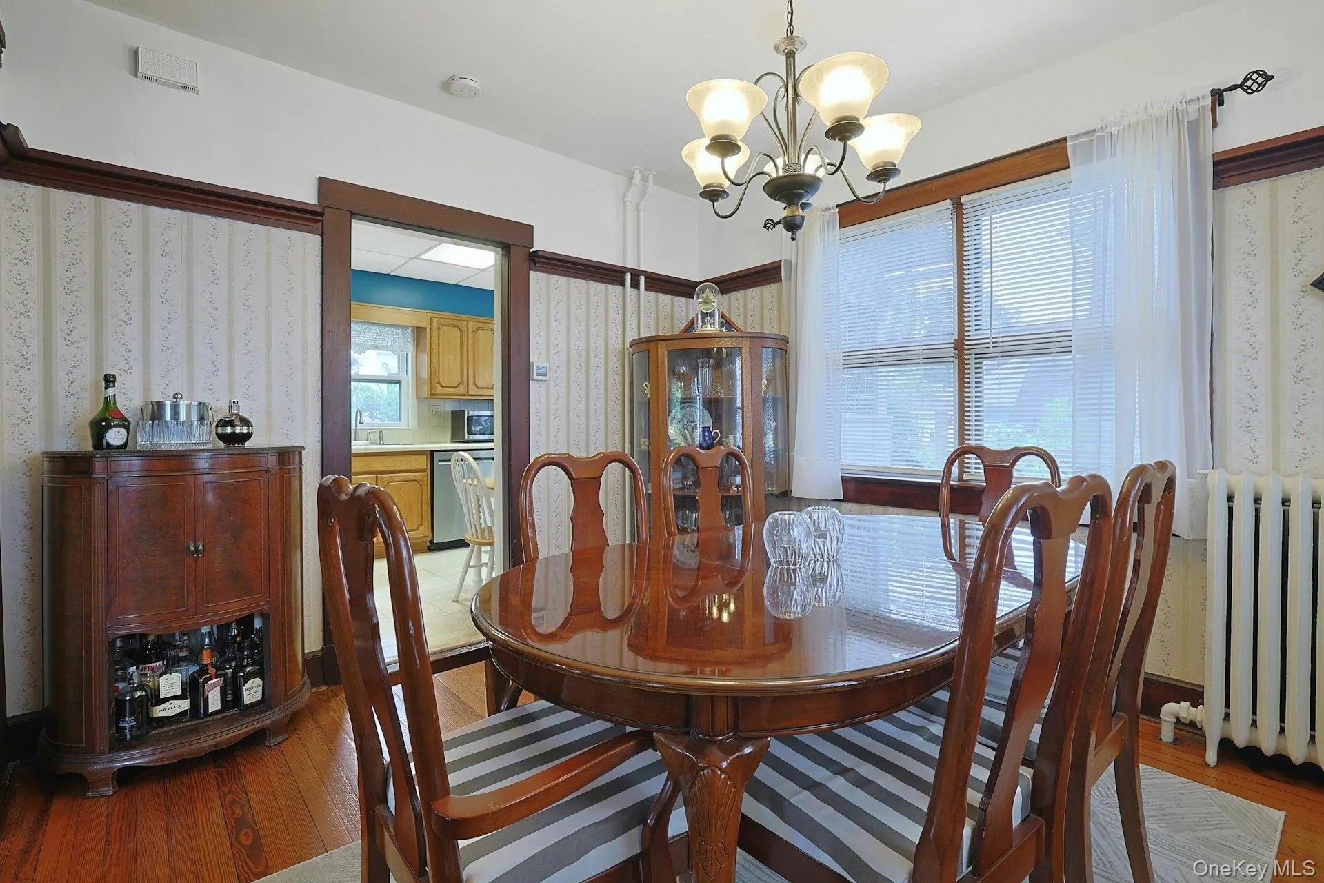 The bright dining room opens into the kitchen, creating easy travel for the chef. The bright dining room opens into the kitchen, creating easy travel for the chef.