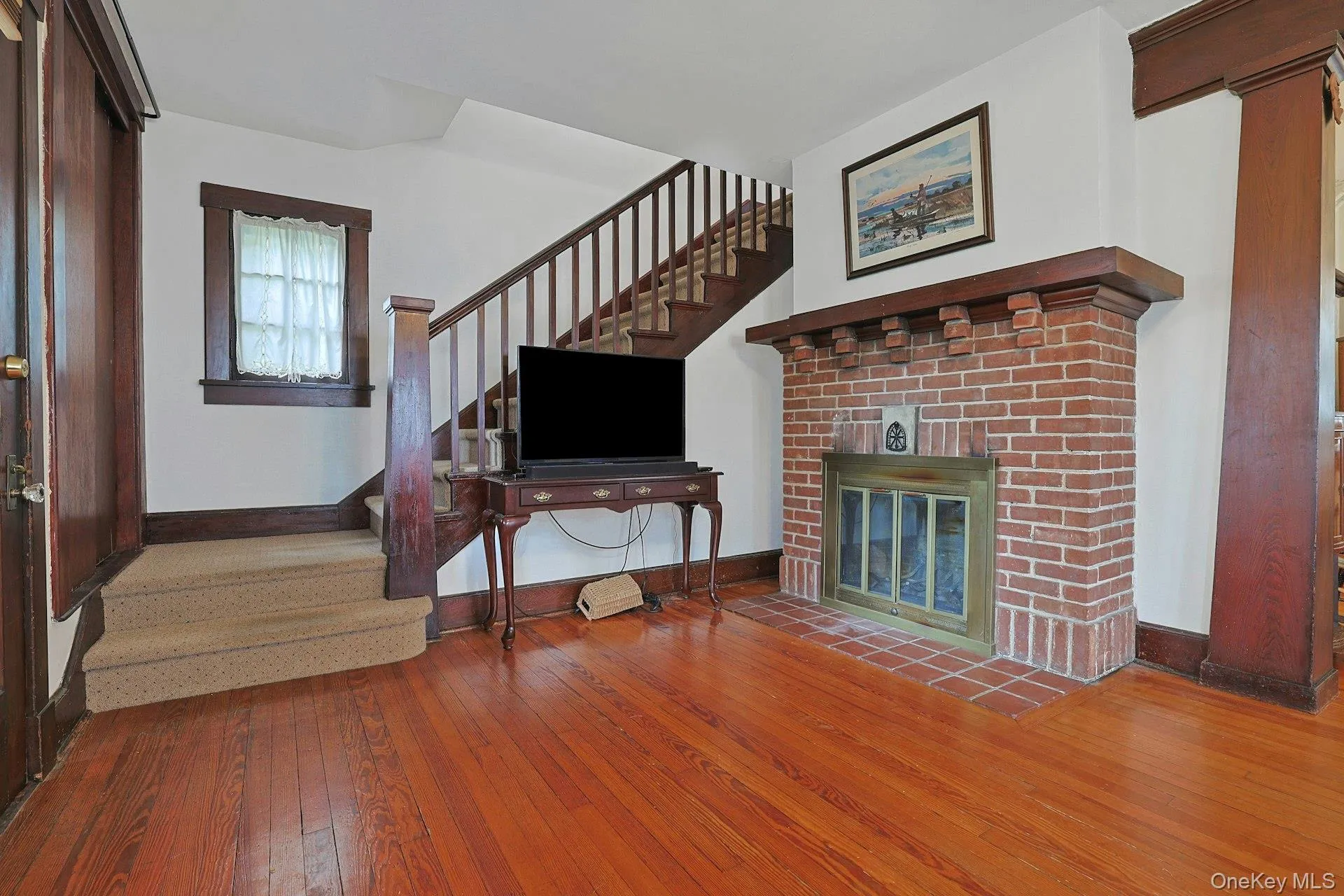 Cozy up by the brick wood-burning fireplace, a focal point feature of the living room. Cozy up by the brick wood-burning fireplace, a focal point feature of the living room.