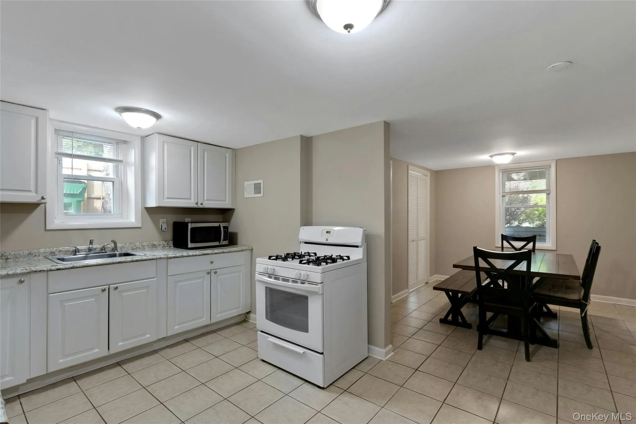 Lower-level kitchen with separate dining area. Lower-level kitchen with separate dining area.
