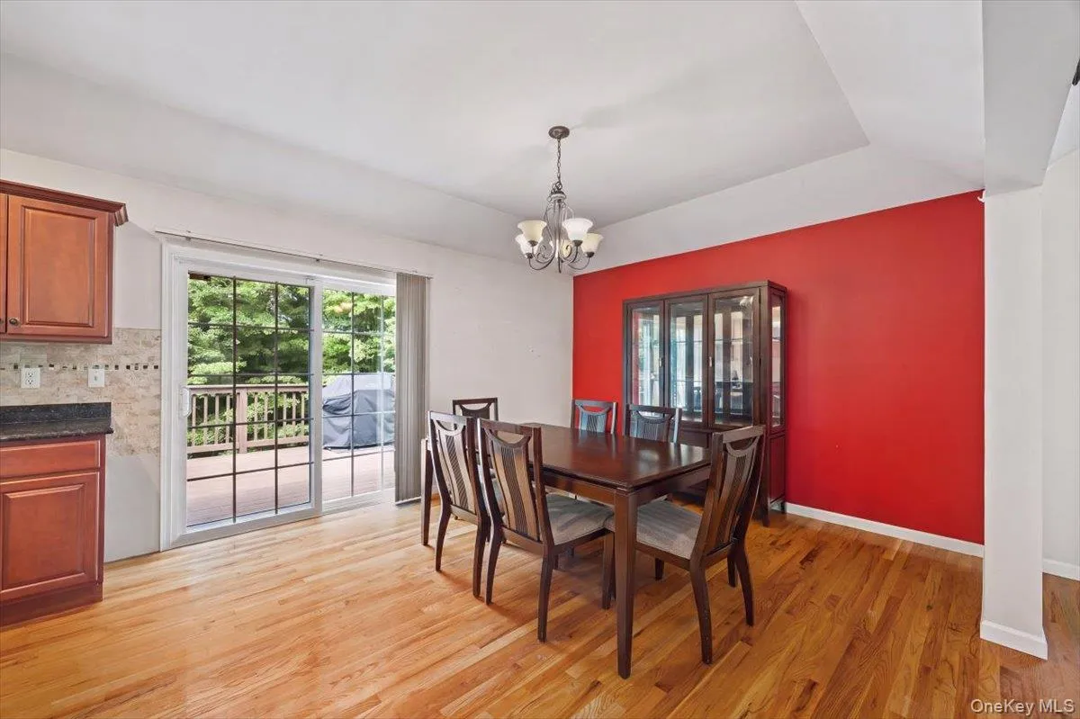 Dining room with sliders to the rear deck. Dining room with sliders to the rear deck.