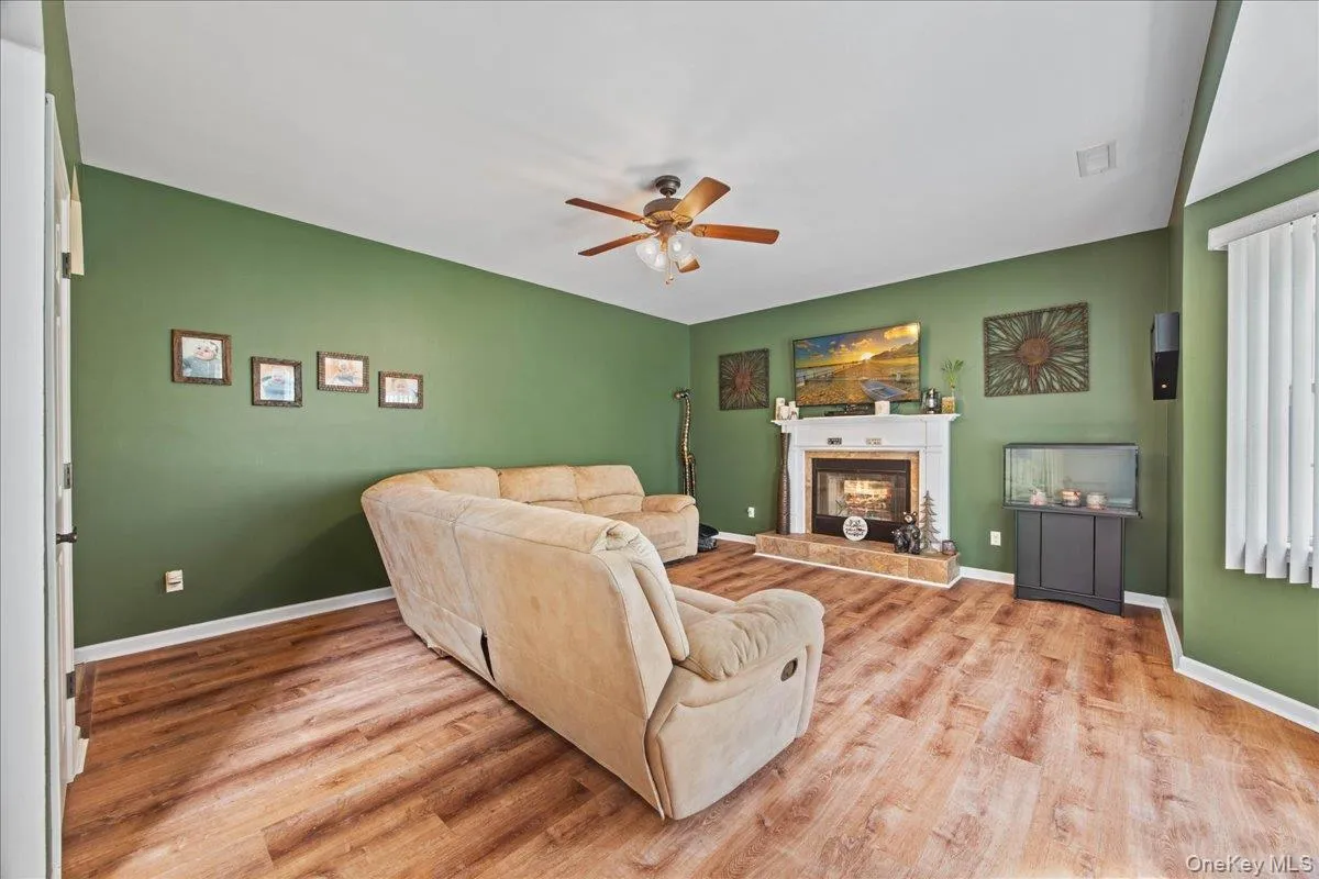 First level living room with fireplace. First level living room with fireplace.