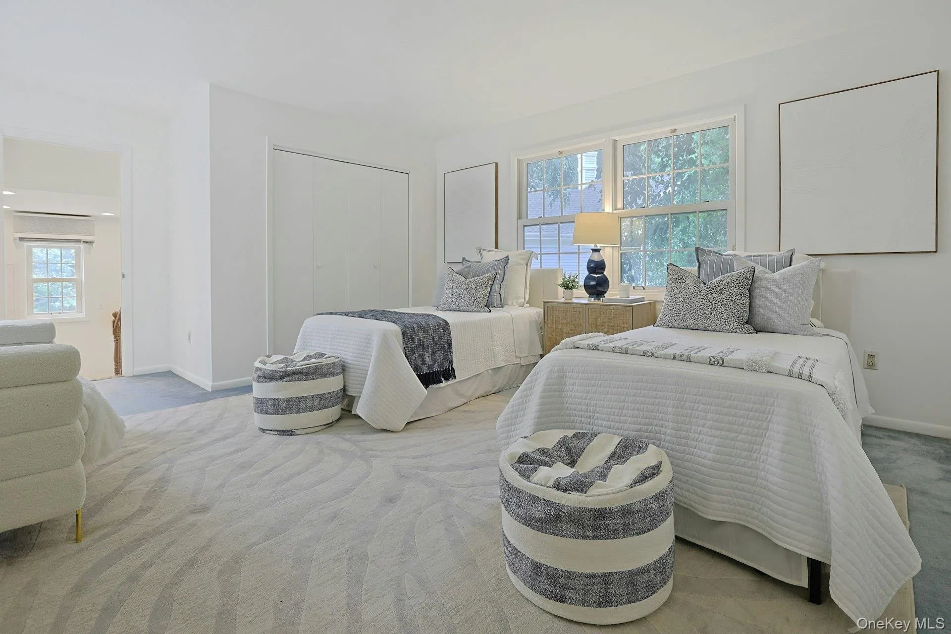 Another generously sized bedroom offers comfortable accommodations and a peaceful view of the surrounding greenery. Another generously sized bedroom offers comfortable accommodations and a peaceful view of the surrounding greenery.