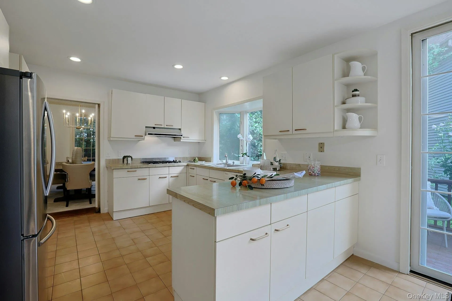 Generously sized kitchen with abundant cabinetry and plenty of workspace for everyday cooking and entertaining. Generously sized kitchen with abundant cabinetry and plenty of workspace for everyday cooking and entertaining.