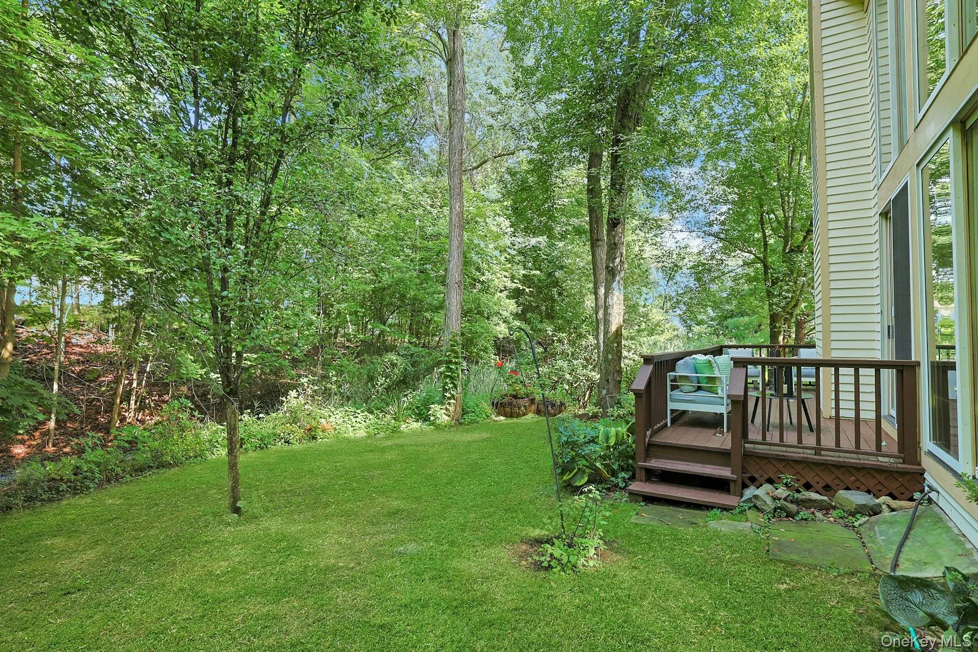 Lush backyard setting surrounded by mature trees and landscaping creates a wonderful sense of privacy and tranquility. Lush backyard setting surrounded by mature trees and landscaping creates a wonderful sense of privacy and tranquility.