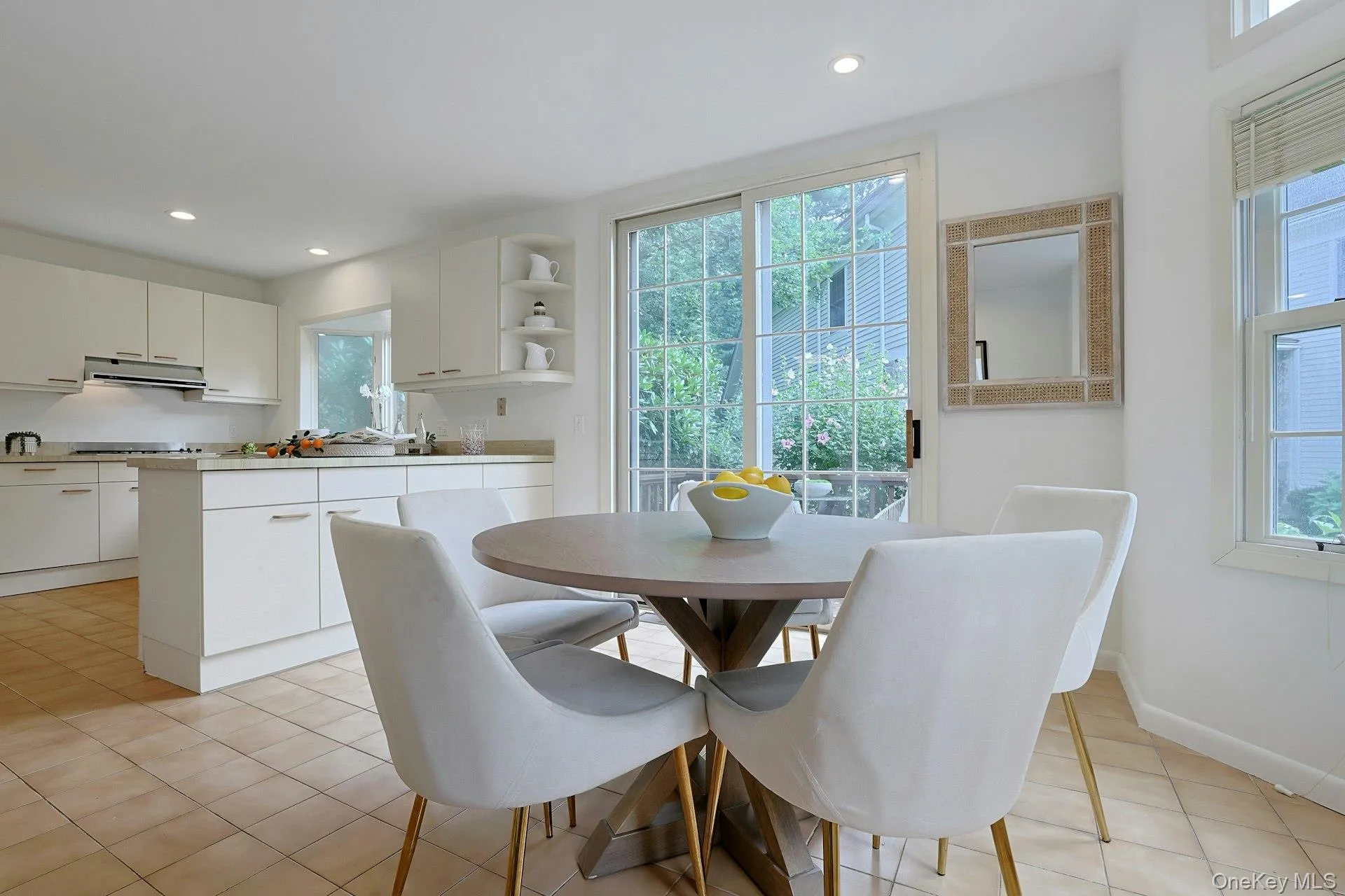 The eat-in kitchen flows seamlessly into the cheerful breakfast area with direct access to the outdoors. The eat-in kitchen flows seamlessly into the cheerful breakfast area with direct access to the outdoors.