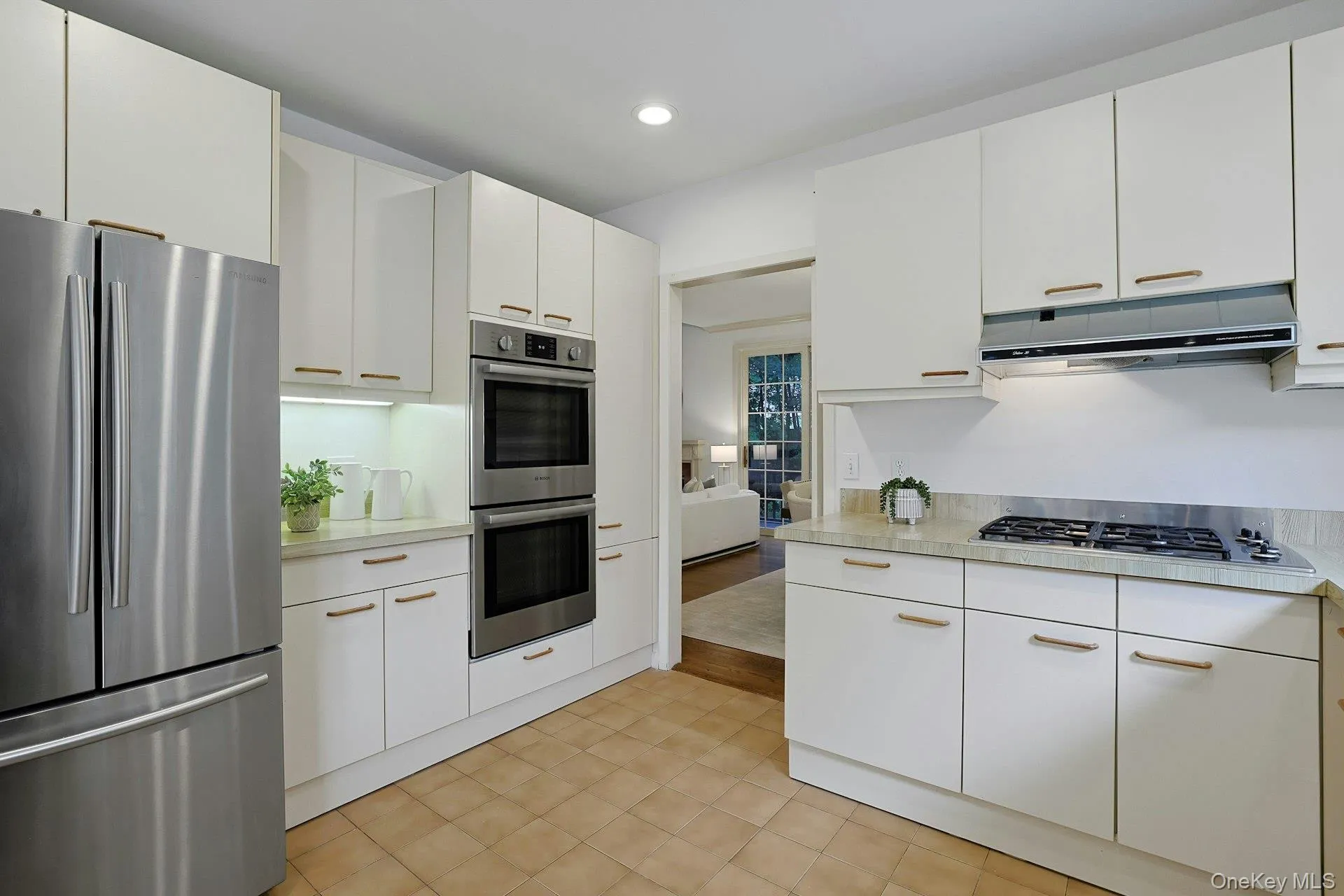 Additional kitchen view highlighting the extensive cabinetry, stainless steel appliances and convenient layout. Additional kitchen view highlighting the extensive cabinetry, stainless steel appliances and convenient layout.