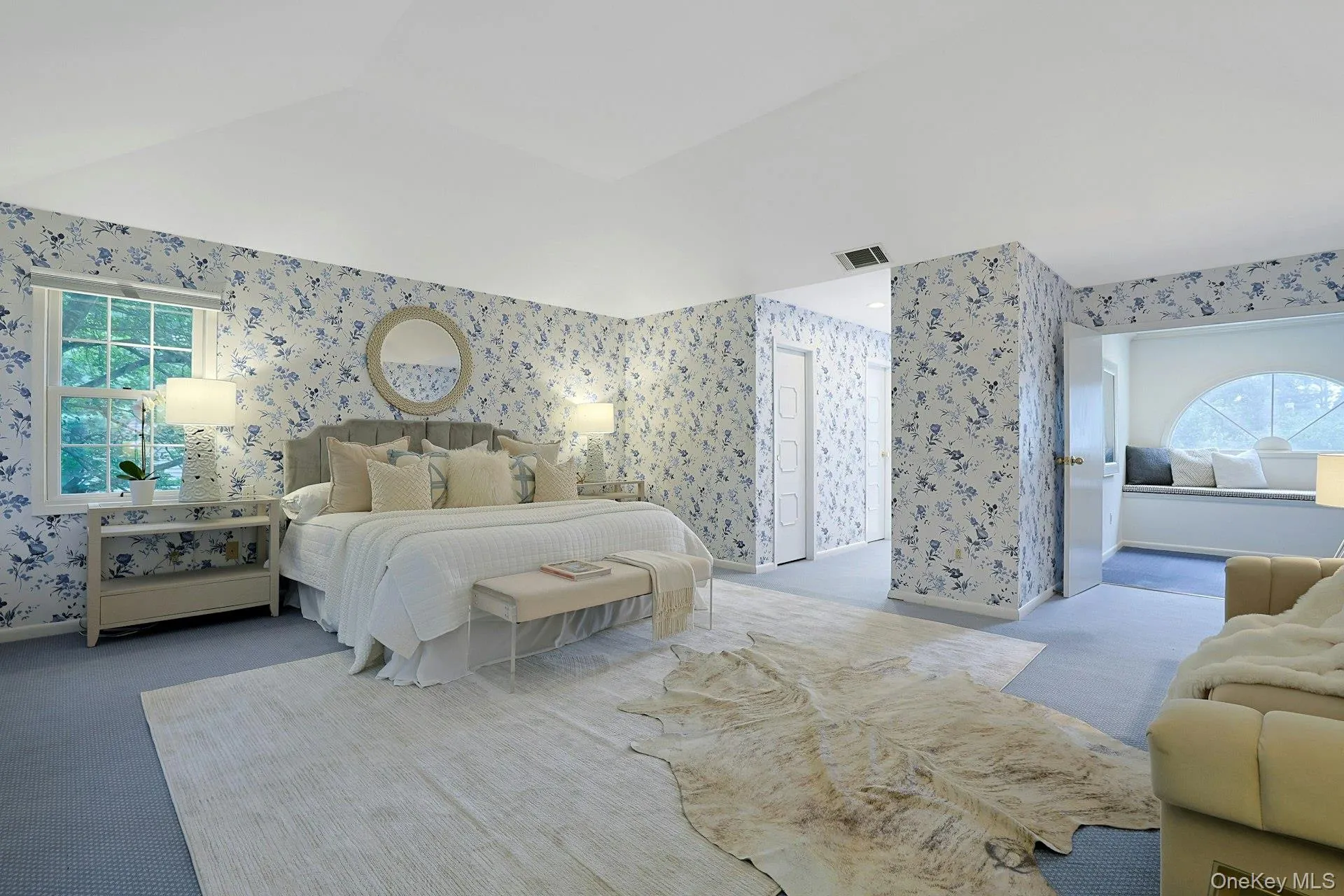 Another perspective of the expansive primary suite, with easy access to the dressing and bath areas beyond. Another perspective of the expansive primary suite, with easy access to the dressing and bath areas beyond.