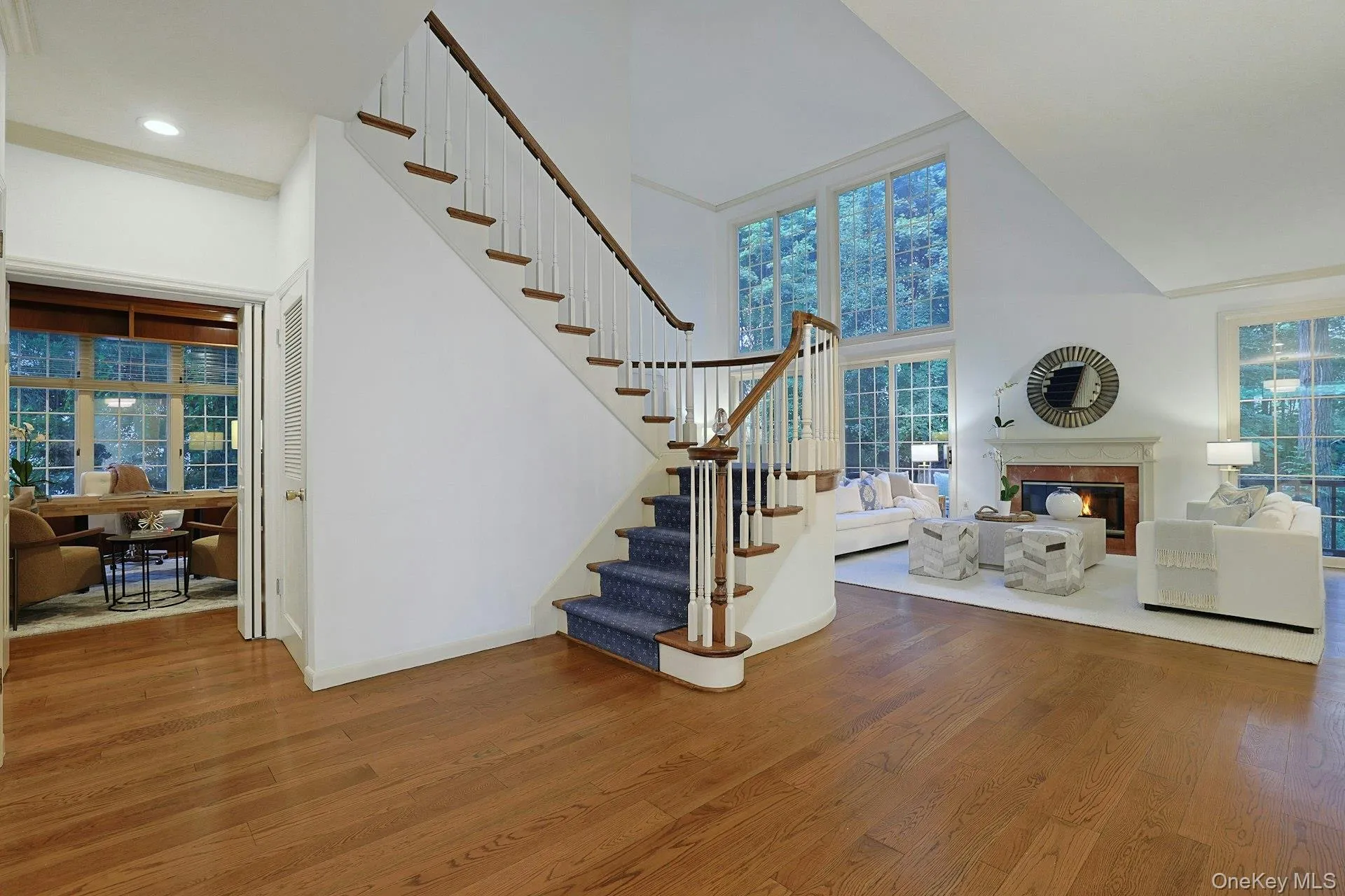 A dramatic first impression with soaring ceilings, abundant natural light and oak flooring throughout the main level. Large office to the left. A dramatic first impression with soaring ceilings, abundant natural light and oak flooring throughout the main level. Large office to the left.