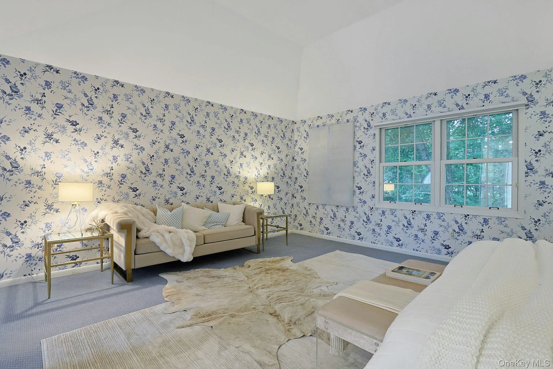 A comfortable sitting area within the primary bedroom highlights the impressive scale and versatility of the suite. A comfortable sitting area within the primary bedroom highlights the impressive scale and versatility of the suite.