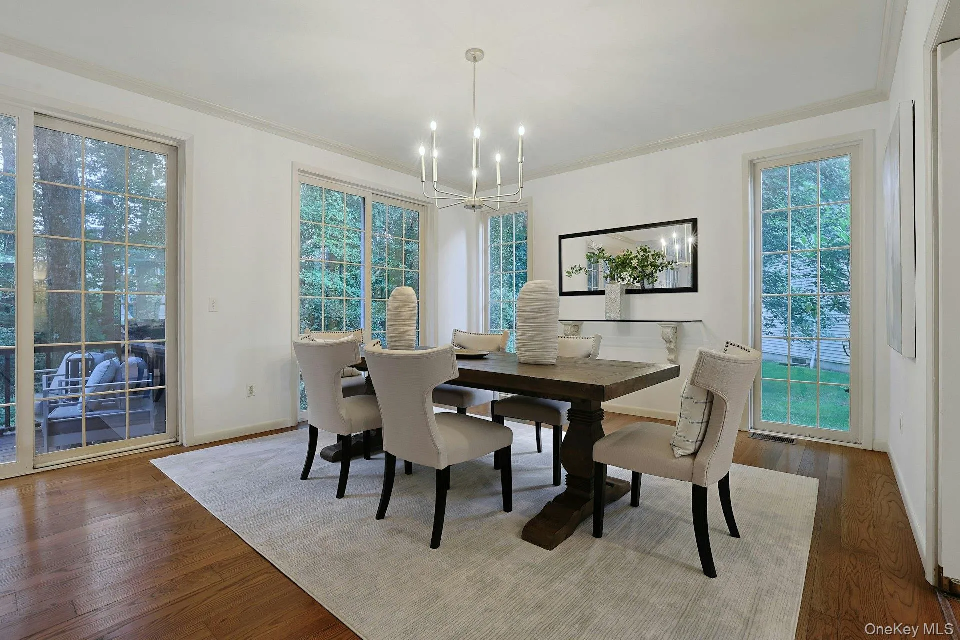 Elegant dining room easily accommodates a large table, providing a wonderful setting for both intimate dinners and larger gatherings. Elegant dining room easily accommodates a large table, providing a wonderful setting for both intimate dinners and larger gatherings.