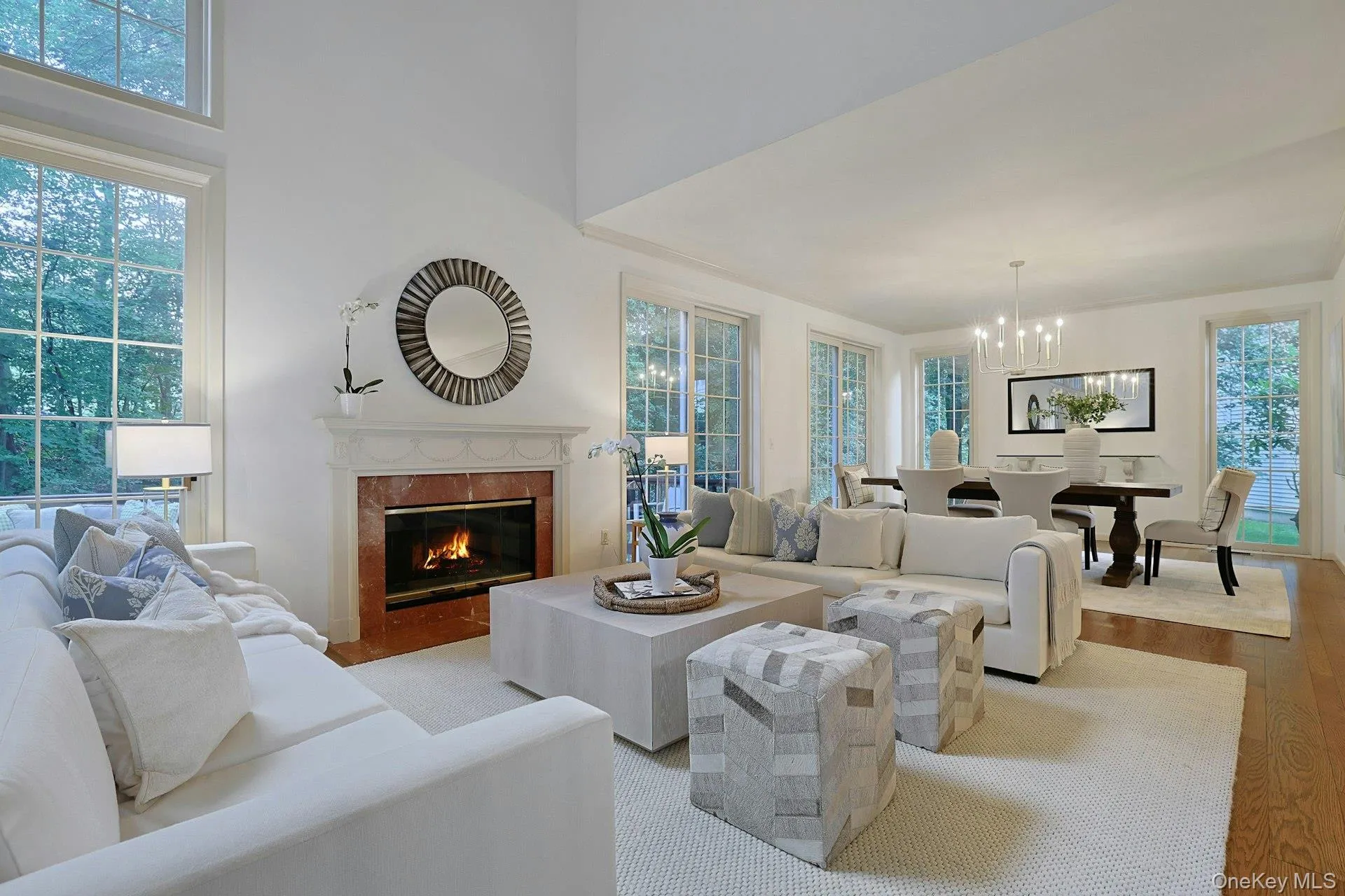 Beautifully proportioned living and dining spaces flow together while retaining distinct areas for relaxing and entertaining. Beautifully proportioned living and dining spaces flow together while retaining distinct areas for relaxing and entertaining.