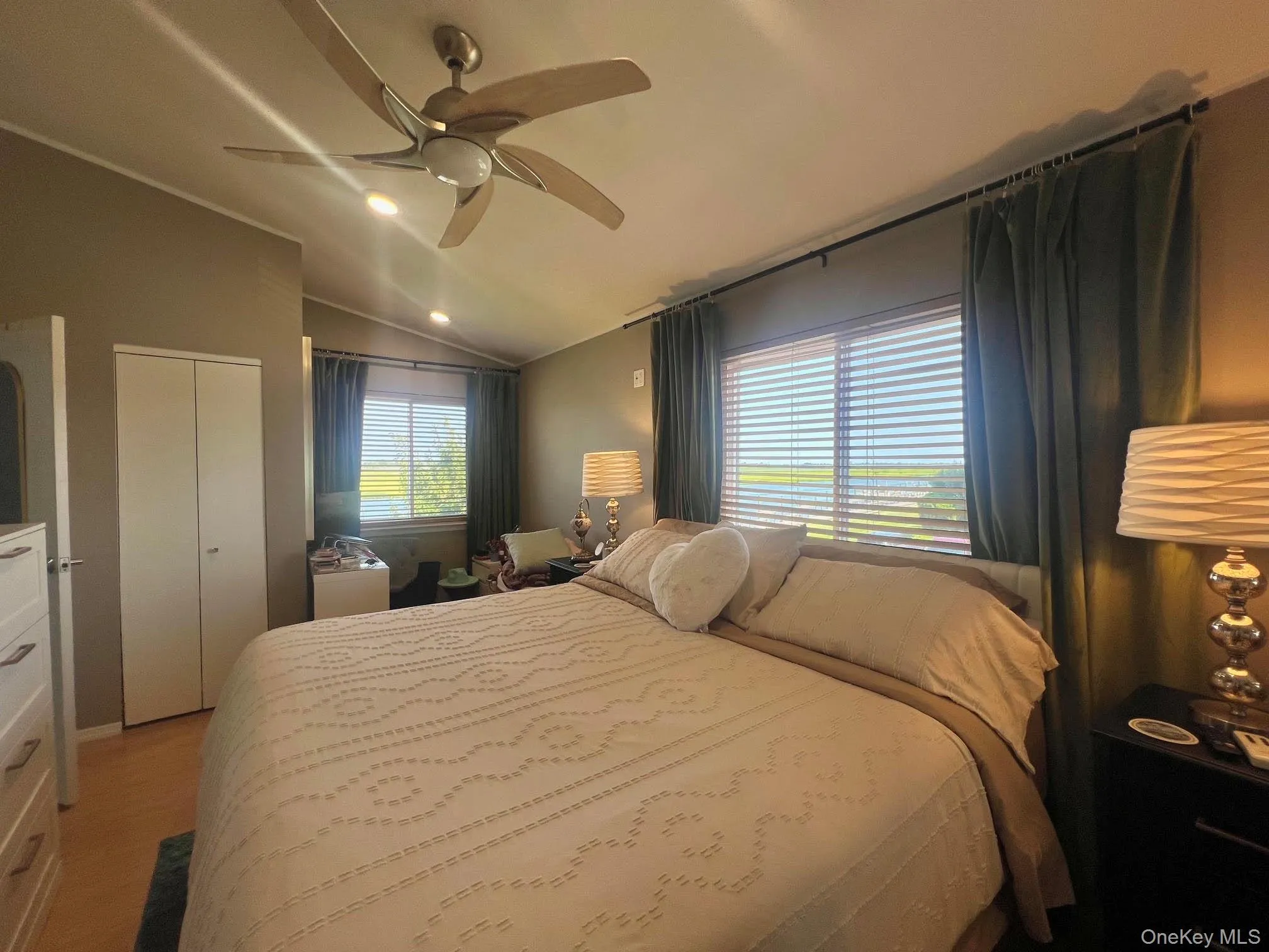 BR view w/Vaulted Ceiling w/Fan Light, HiHats, Lighted Closet with Bi-Fold Door and deep shelving BR view w/Vaulted Ceiling w/Fan Light, HiHats, Lighted Closet with Bi-Fold Door and deep shelving