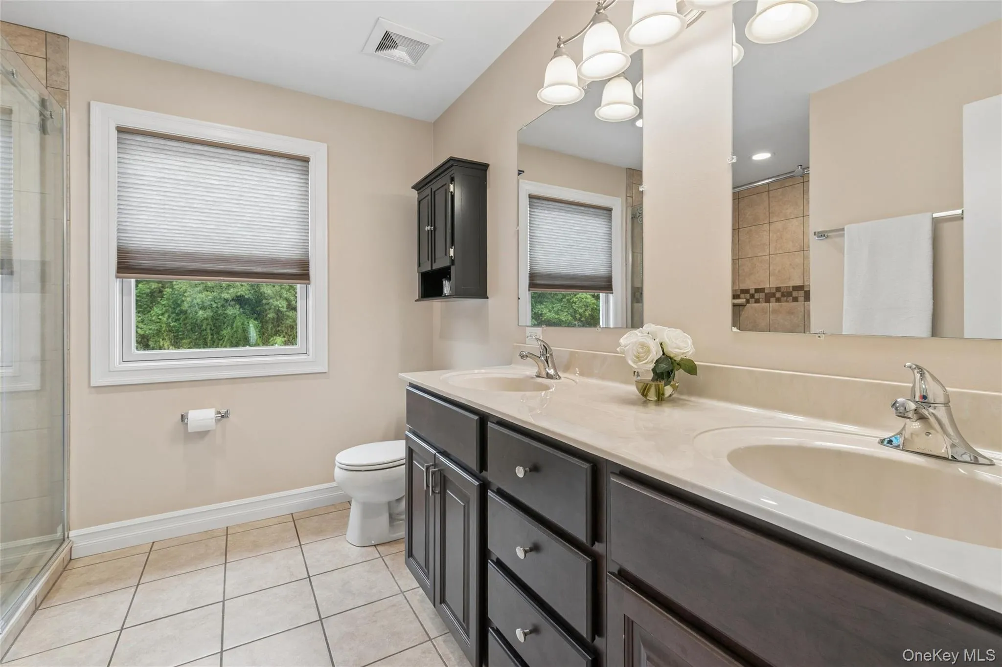 Primary Bath w/Dual Vanity and Beautifully Tiled Step-in Shower Primary Bath w/Dual Vanity and Beautifully Tiled Step-in Shower