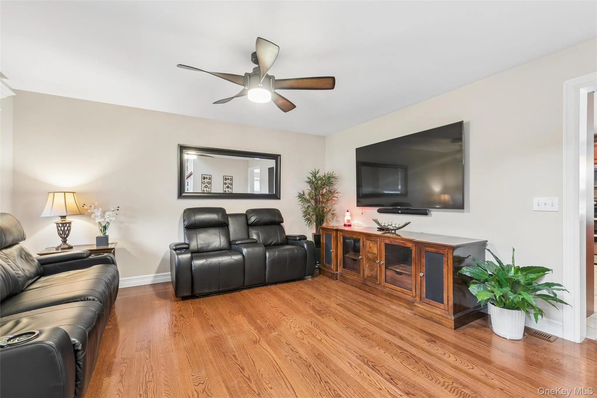 Den with Gleaming Hardwood Floors Den with Gleaming Hardwood Floors