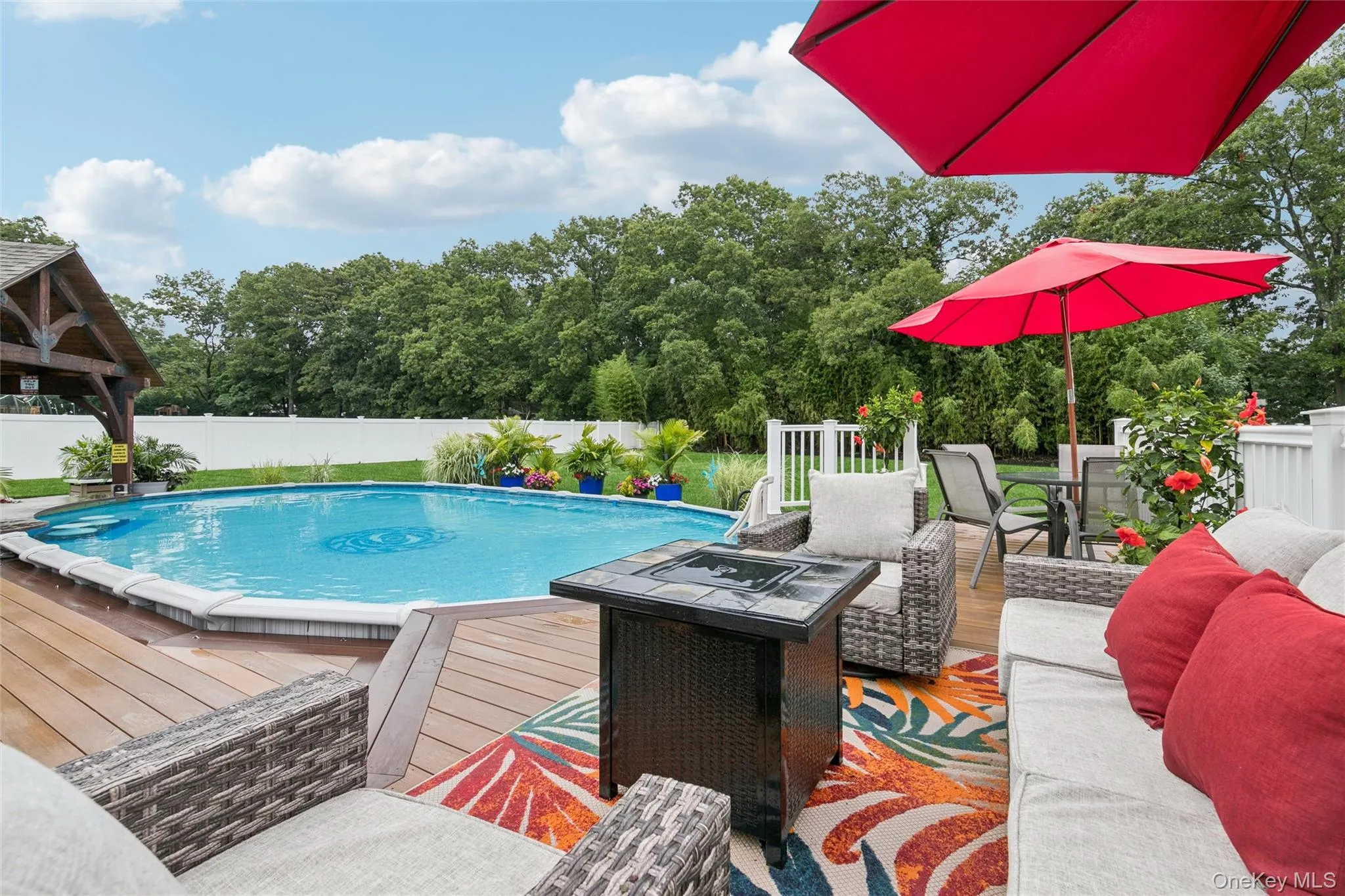 Decking Overlooks Vast Lawn Area with Natural Privacy Behind Decking Overlooks Vast Lawn Area with Natural Privacy Behind
