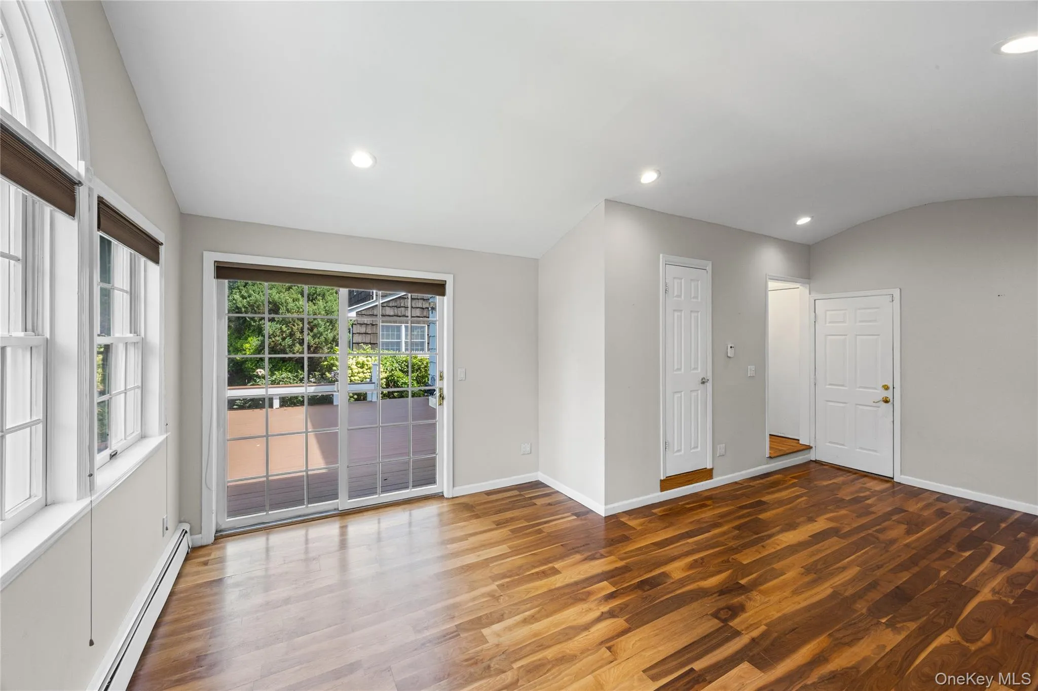 Family room with great access to the large deck space Family room with great access to the large deck space
