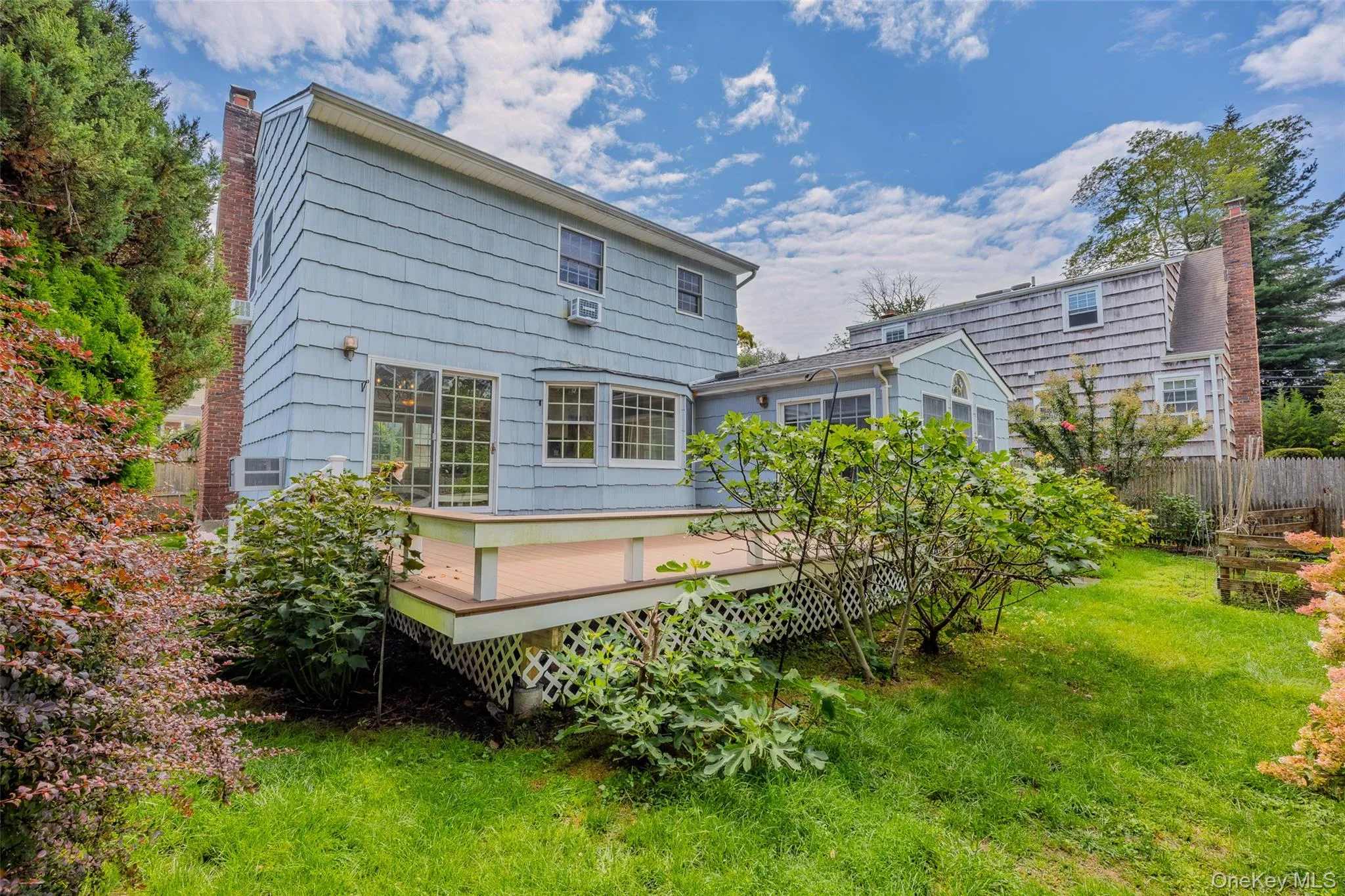 Back of house showing deck and yard space as well Back of house showing deck and yard space as well