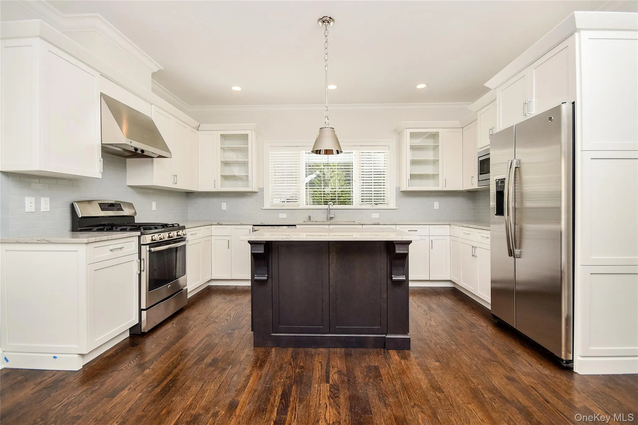 Kitchen with Island and Stainless Appliances Kitchen with Island and Stainless Appliances