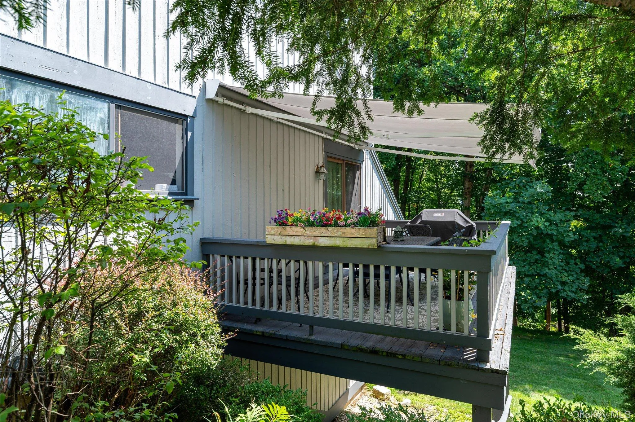 Main level deck with retractable awning Main level deck with retractable awning
