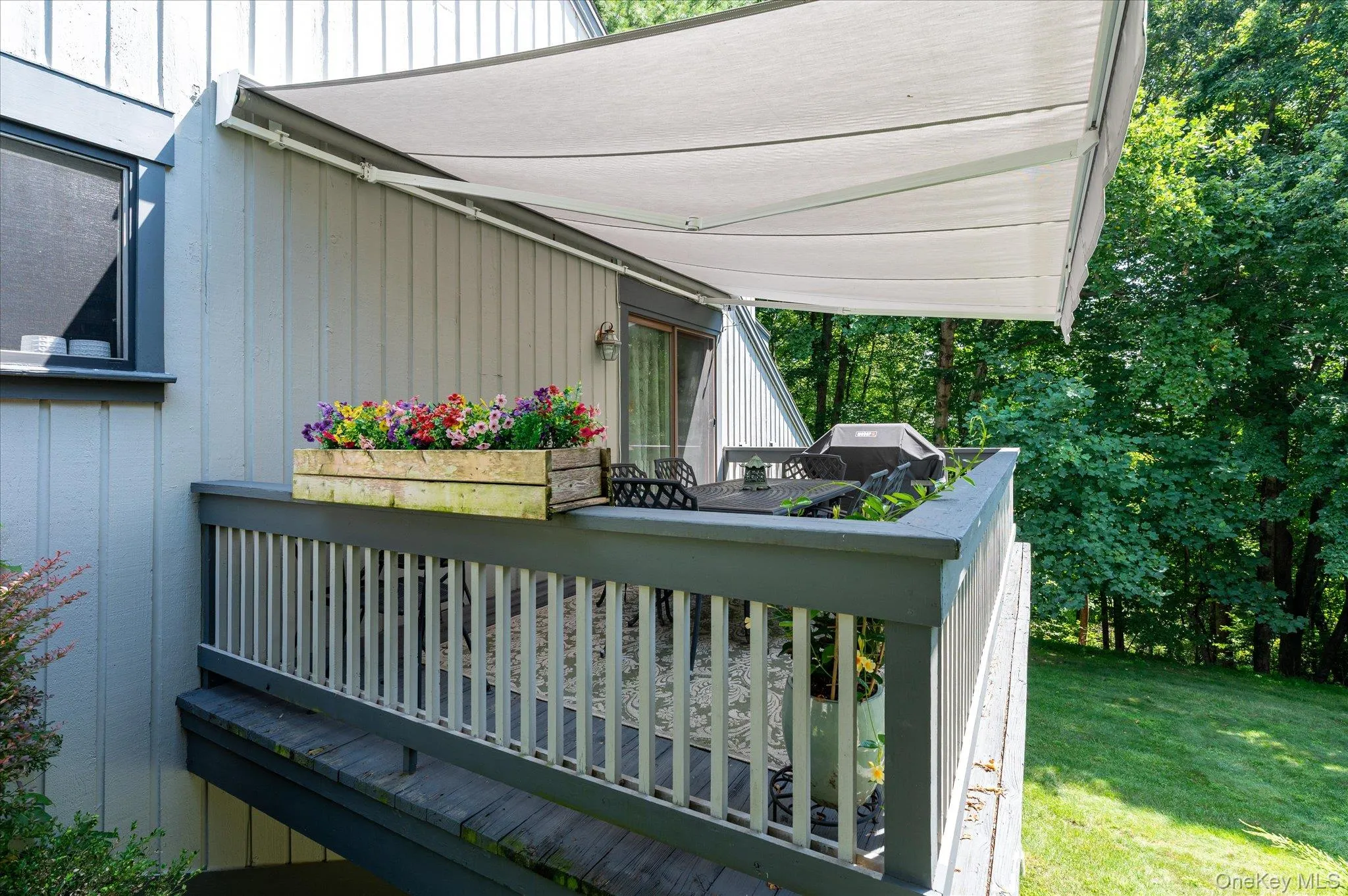 Main level deck with retractable awning Main level deck with retractable awning