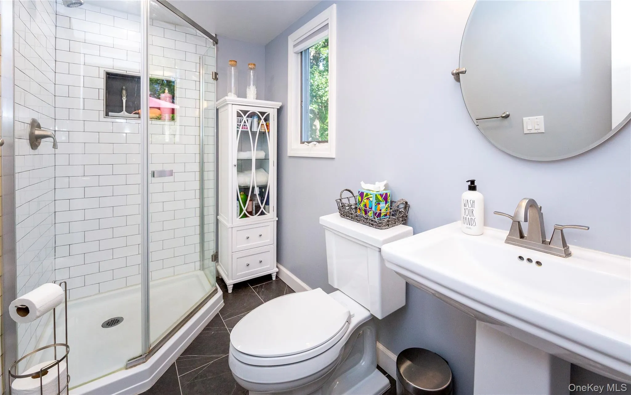 A recently renovated hall bath with walk-in shower. A recently renovated hall bath with walk-in shower.