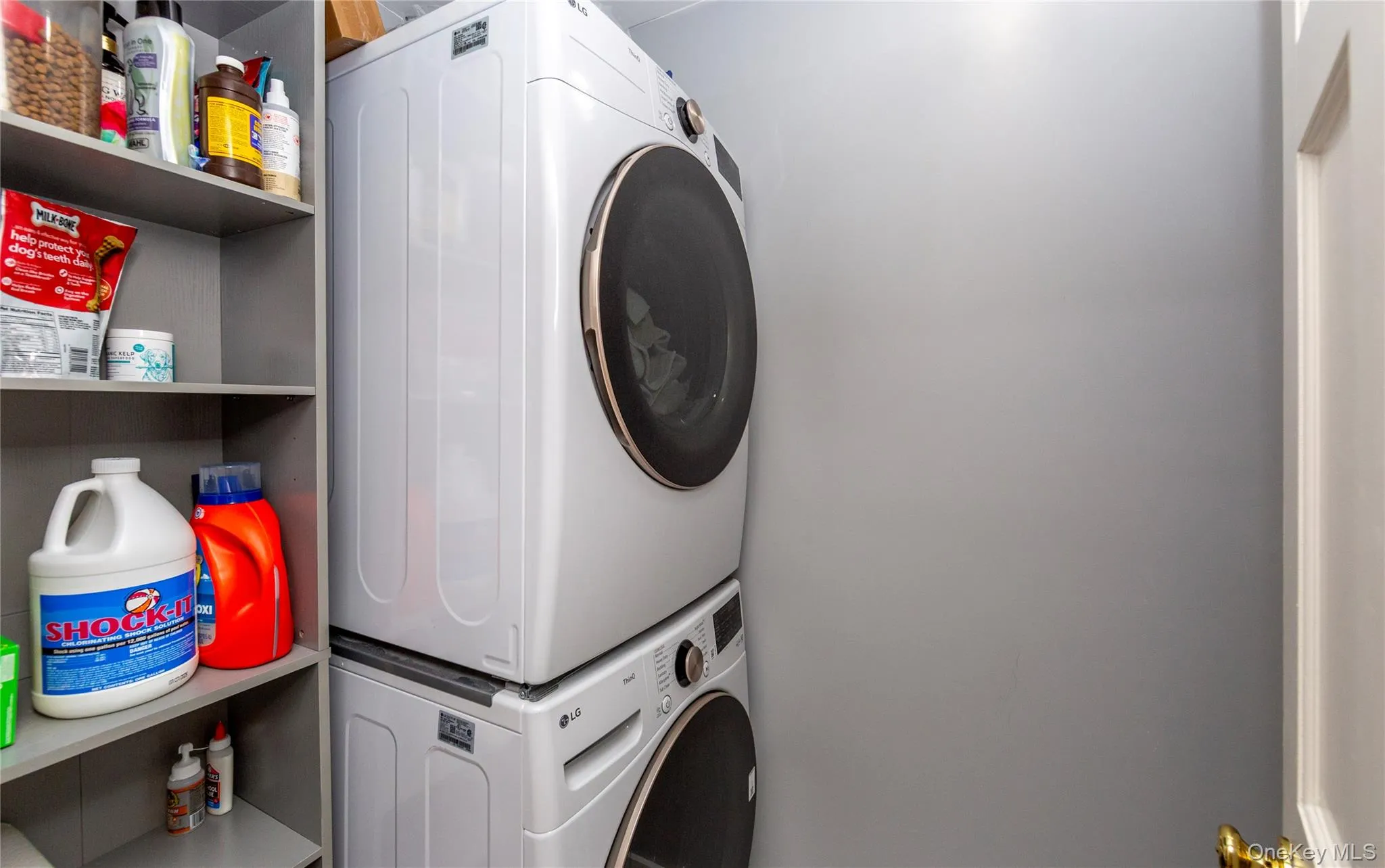 A full-size stacked washer and dryer tucked into a convenient laundry closet, and five additional closets of varying sizes complete the main level. A full-size stacked washer and dryer tucked into a convenient laundry closet, and five additional closets of varying sizes complete the main level.