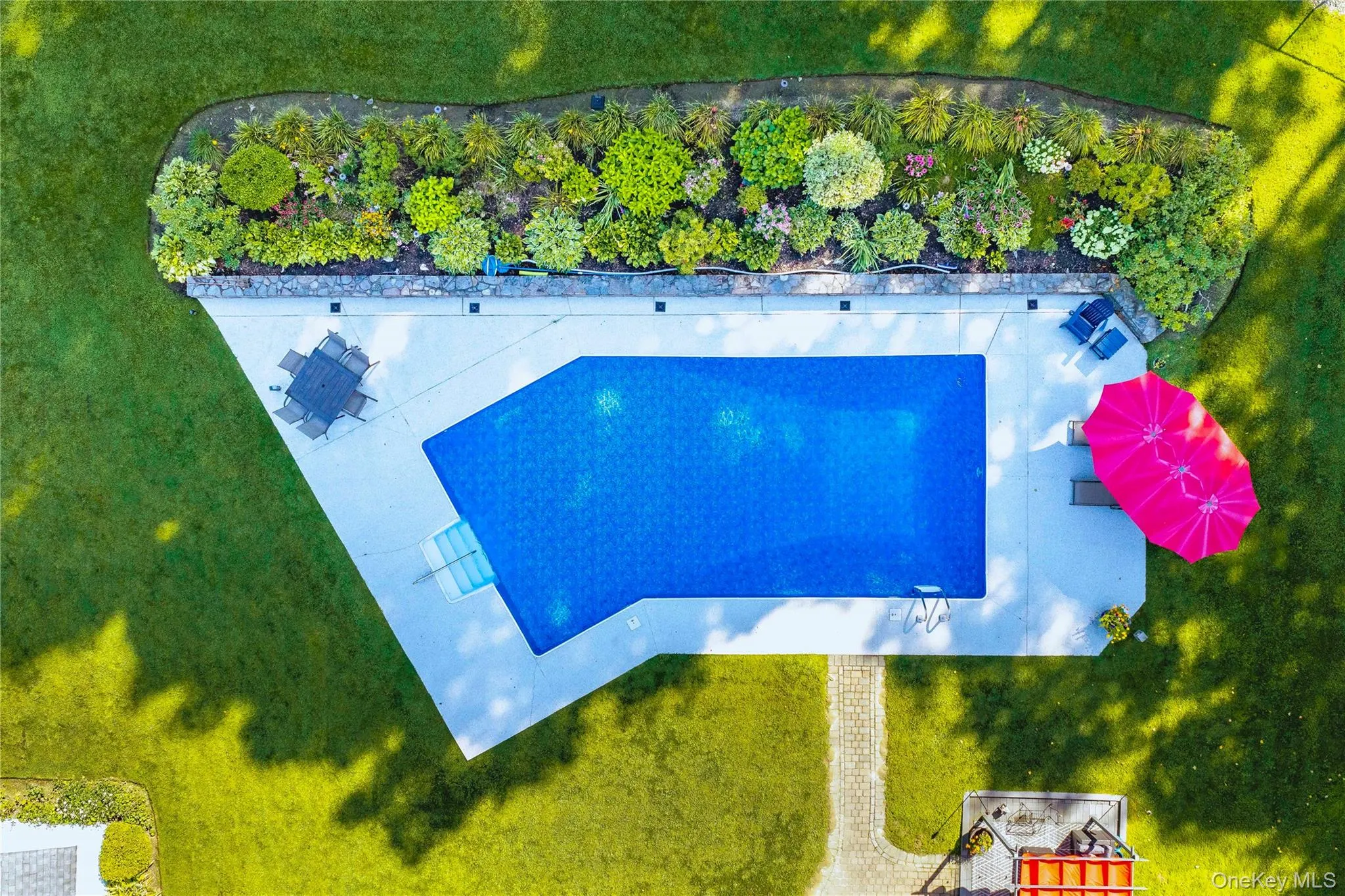 A recently renovated Lazy L heated inground pool. A recently renovated Lazy L heated inground pool.