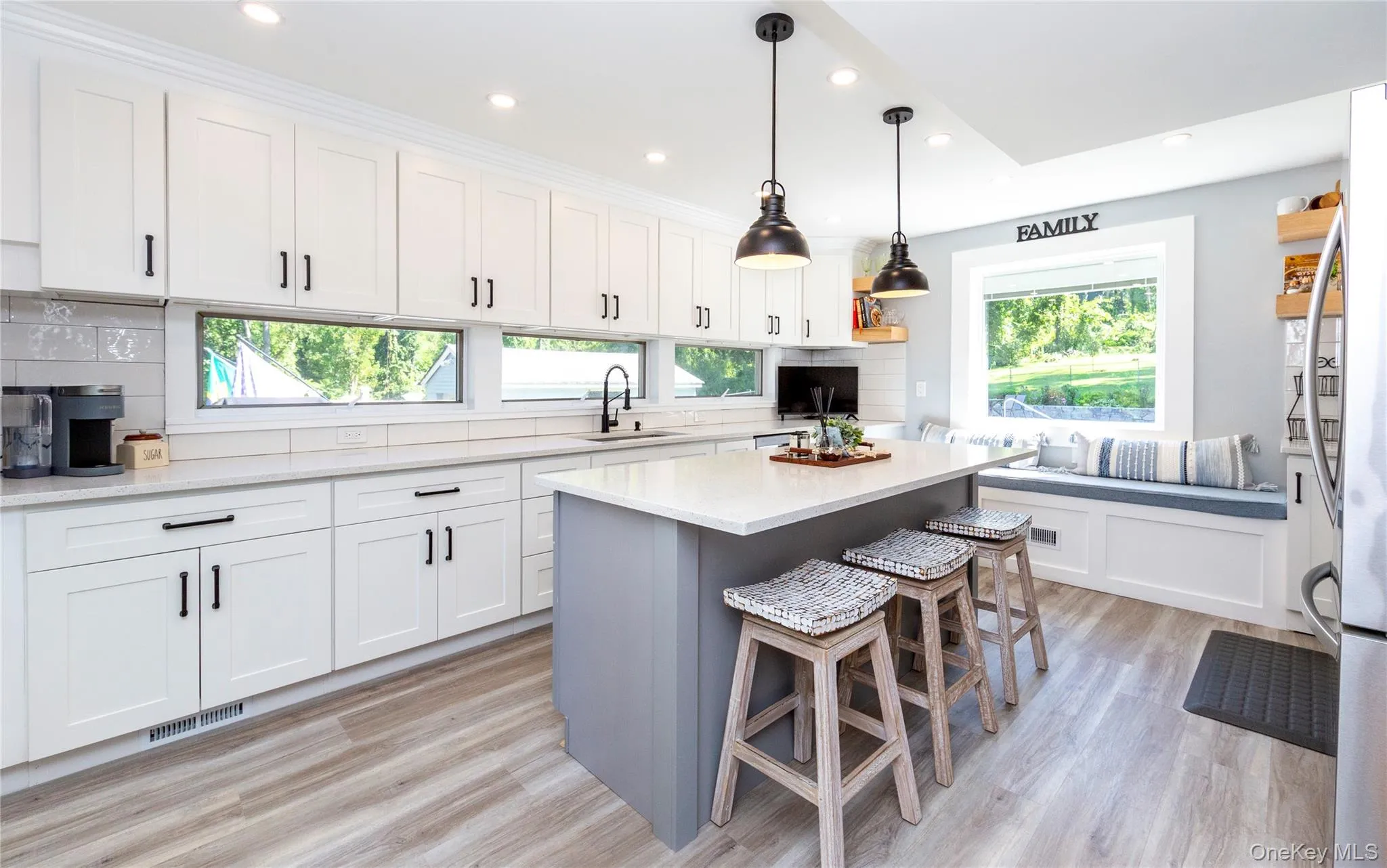 Featuring a center island with seating. Featuring a center island with seating.