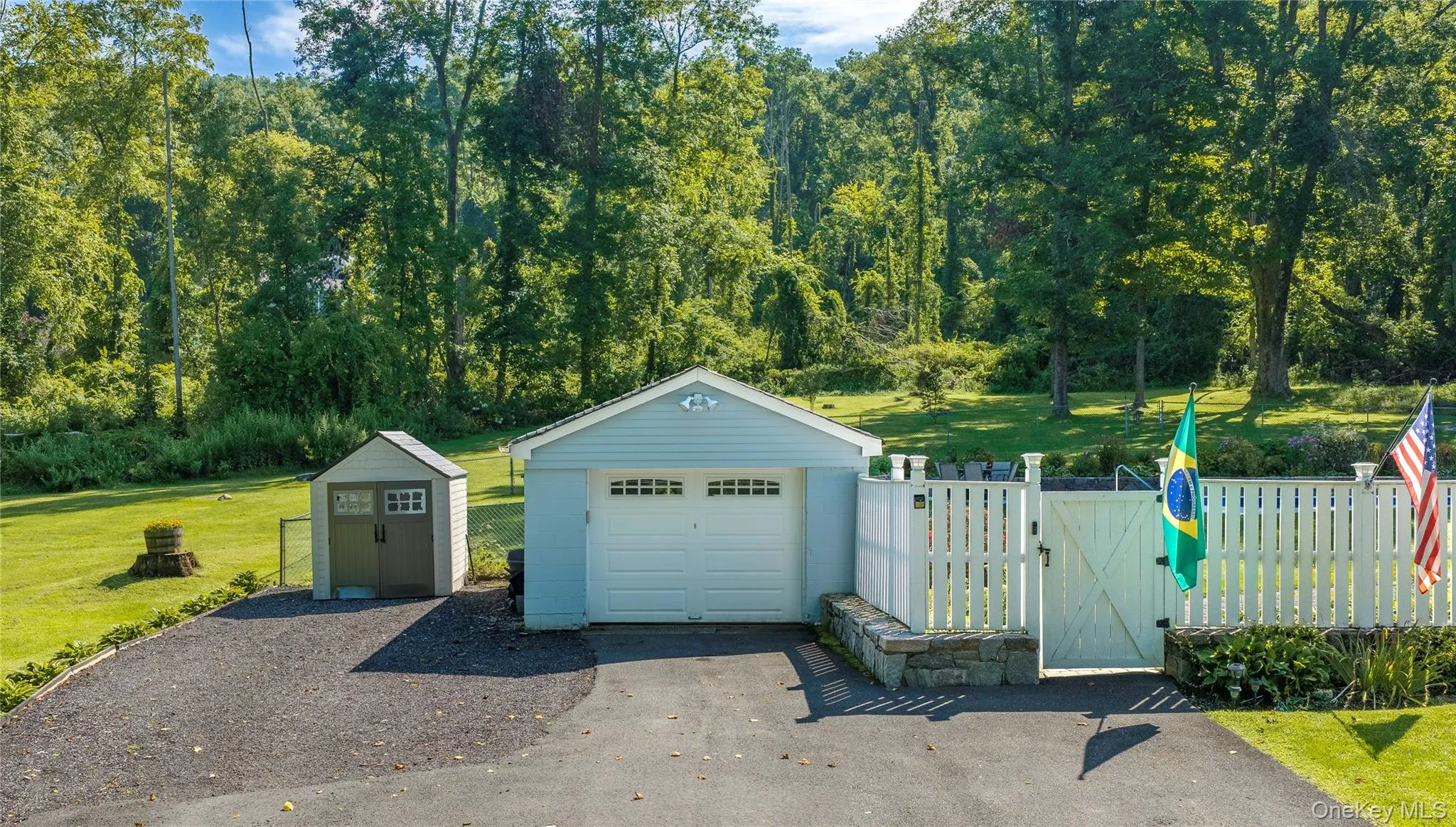 Plenty of parking for visitors. A detached one-car garage and separate shed provide additional storage for gardening tools and equipment. Plenty of parking for visitors. A detached one-car garage and separate shed provide additional storage for gardening tools and equipment.