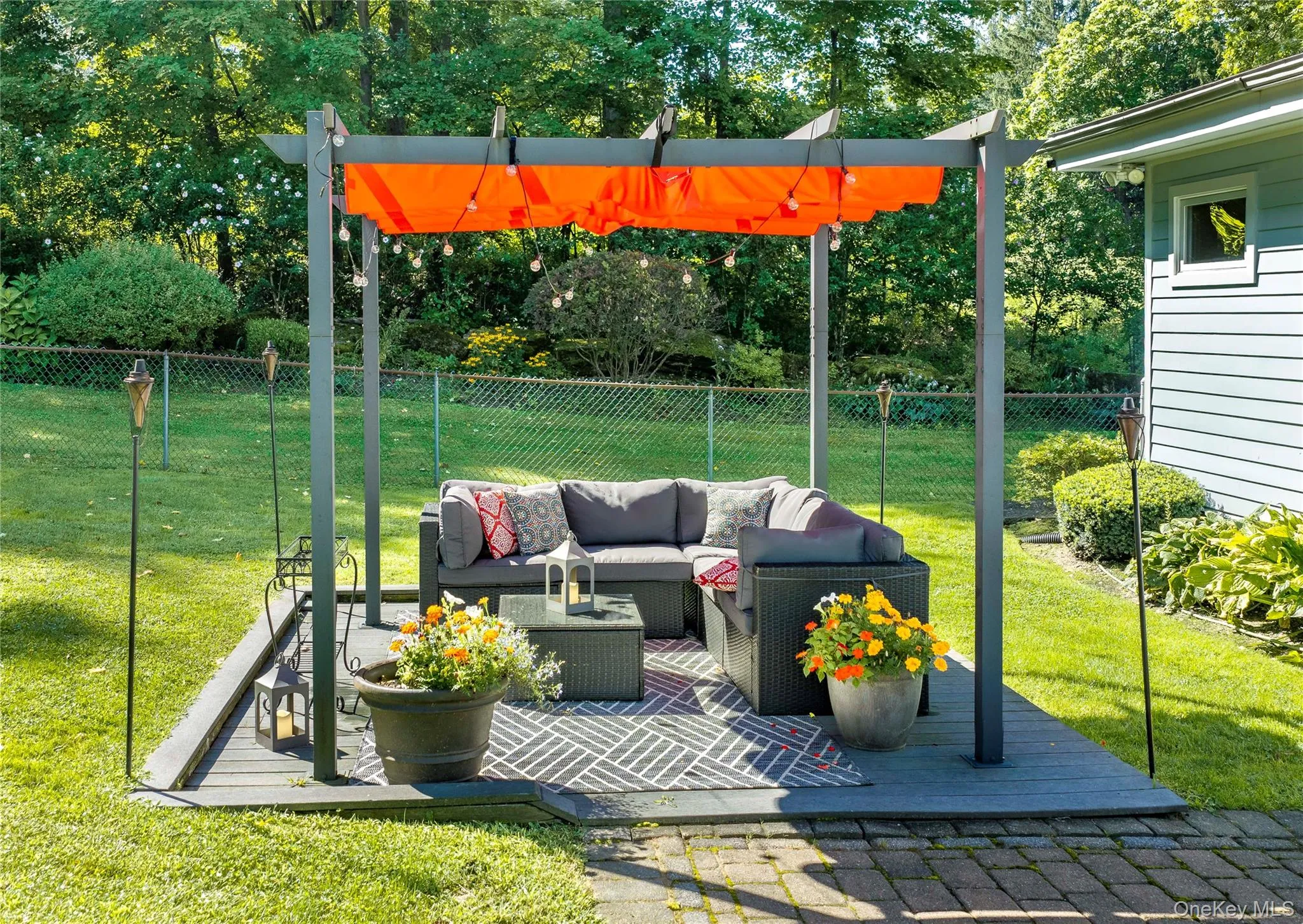 A stone patio area provides the perfect setting for the gazebo, furnished for relaxing and entertaining. A stone patio area provides the perfect setting for the gazebo, furnished for relaxing and entertaining.