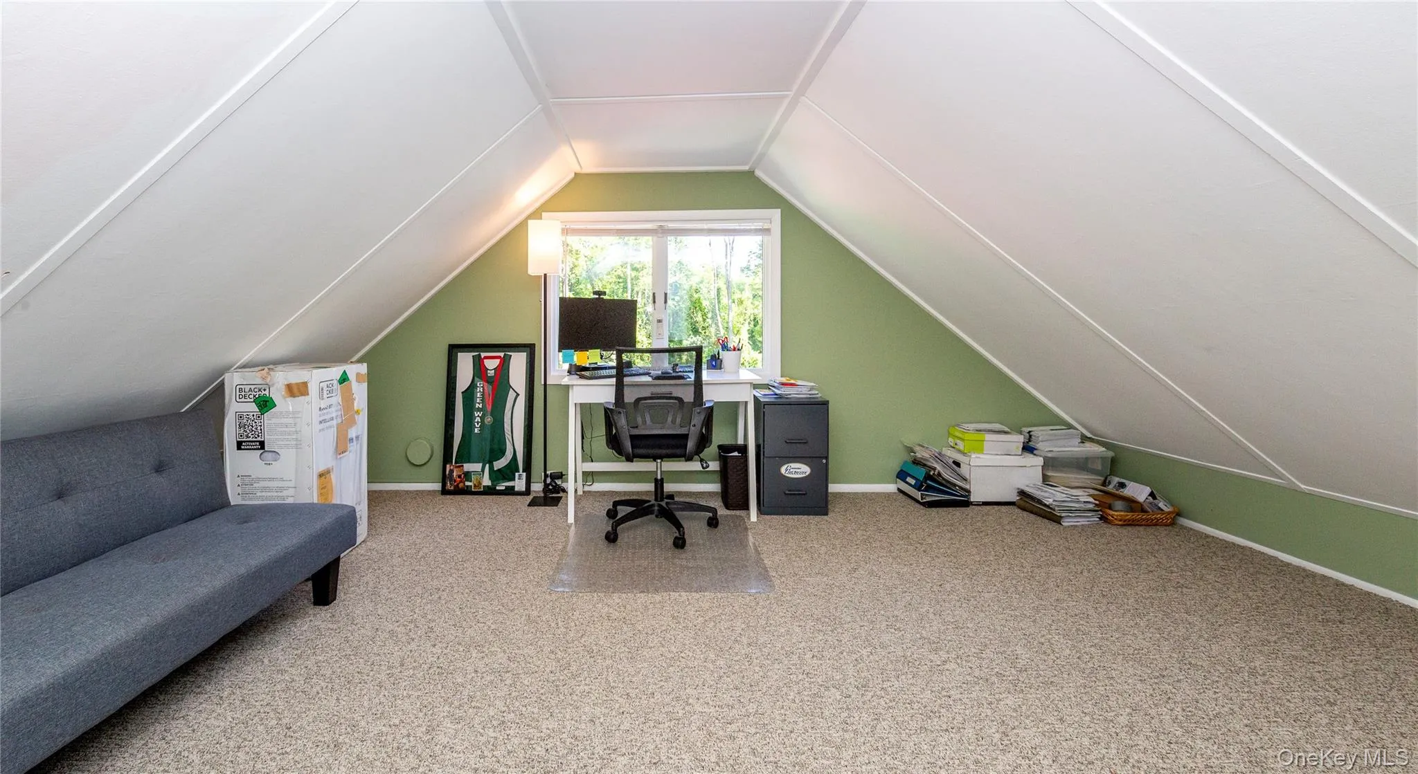 With charming sloped ceilings. With charming sloped ceilings.