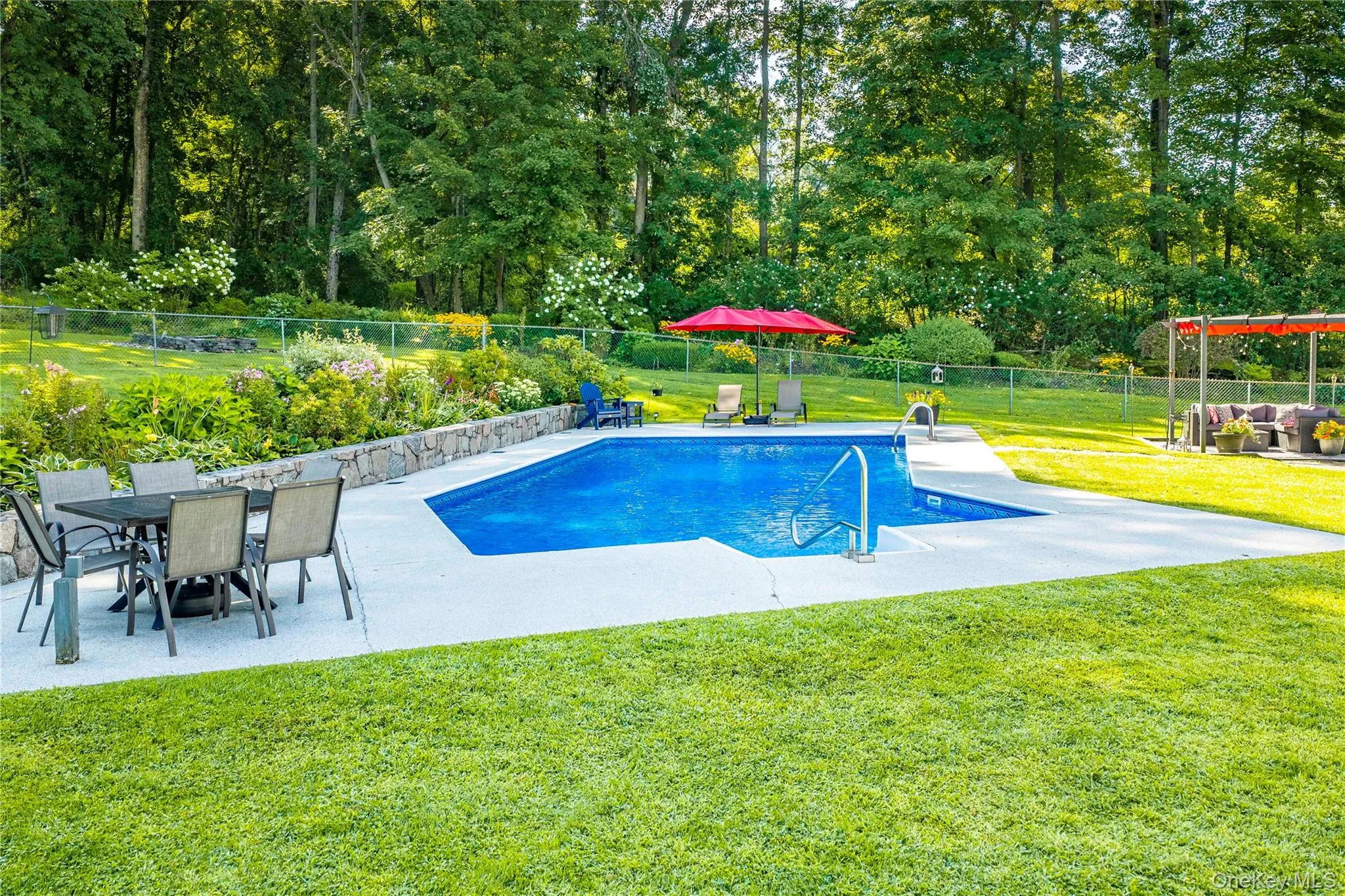 Surrounded by a spacious patio finished with an exceptional concrete coating system, offering plenty of room for lounge chairs and patio furnishings. Surrounded by a spacious patio finished with an exceptional concrete coating system, offering plenty of room for lounge chairs and patio furnishings.