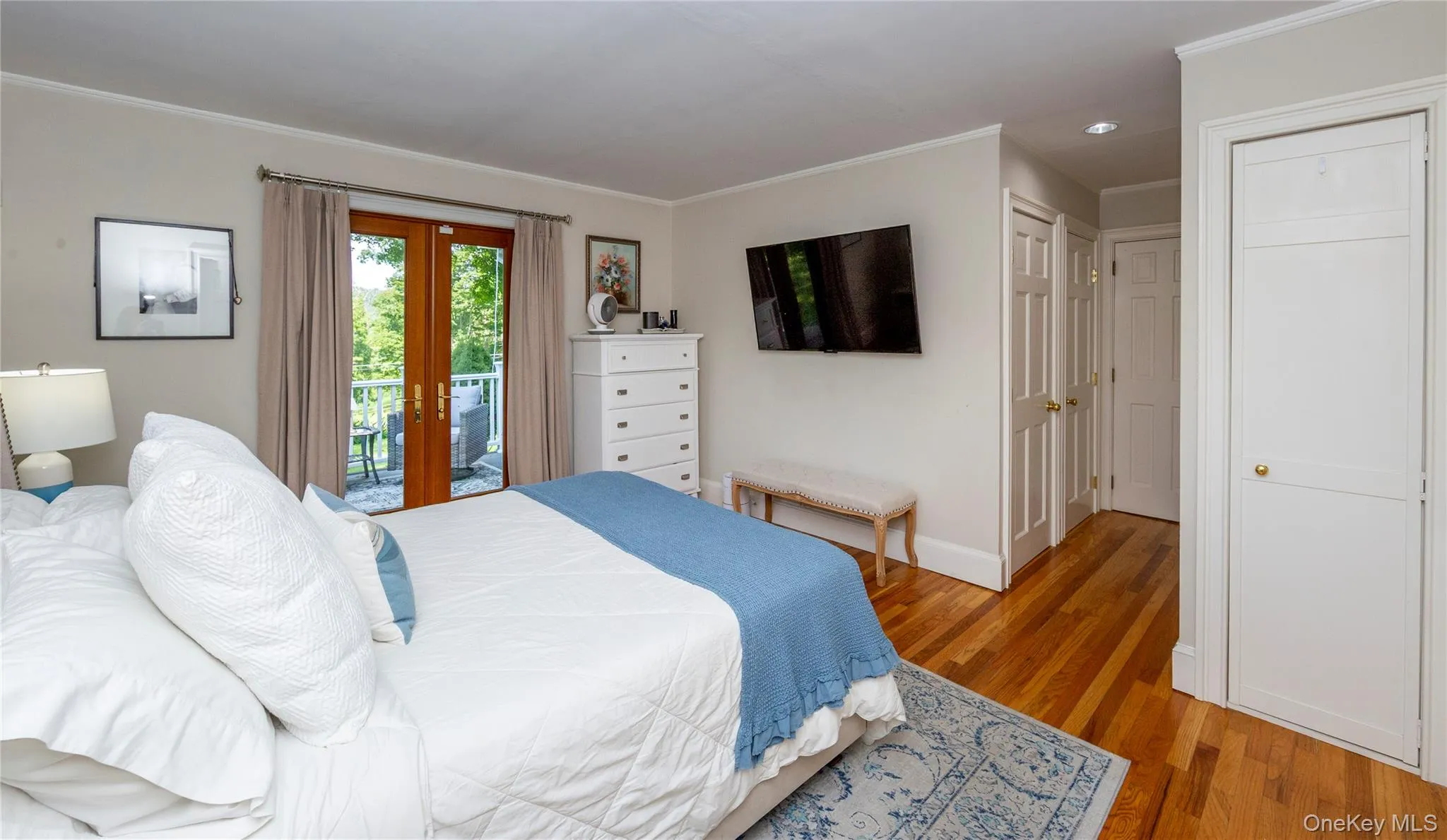 French doors opening to a private deck. Three additional smaller closets. French doors opening to a private deck. Three additional smaller closets.