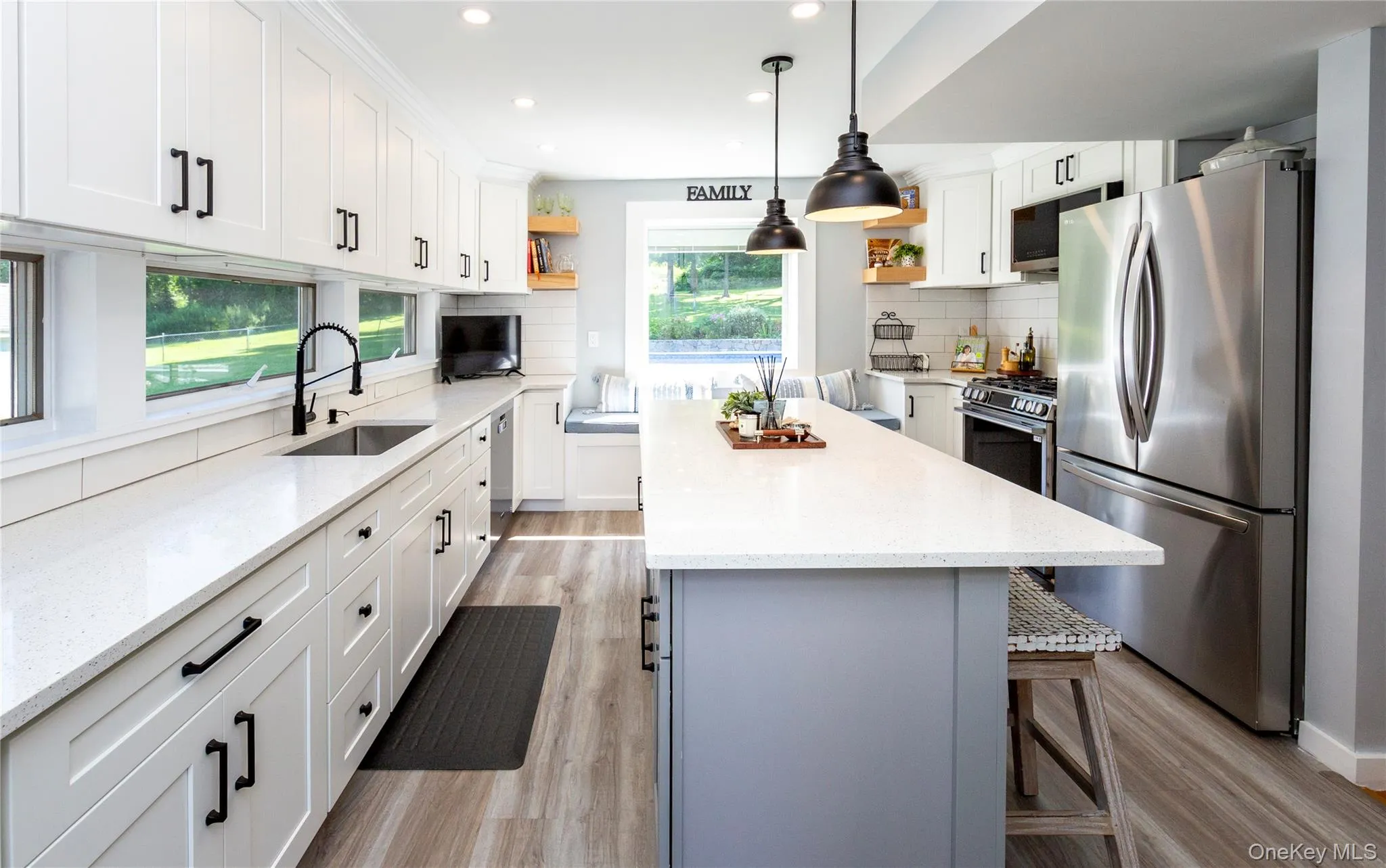 Crisp white cabinetry, quartz countertops, subway tile backsplash, abundant storage and floating shelves. Crisp white cabinetry, quartz countertops, subway tile backsplash, abundant storage and floating shelves.