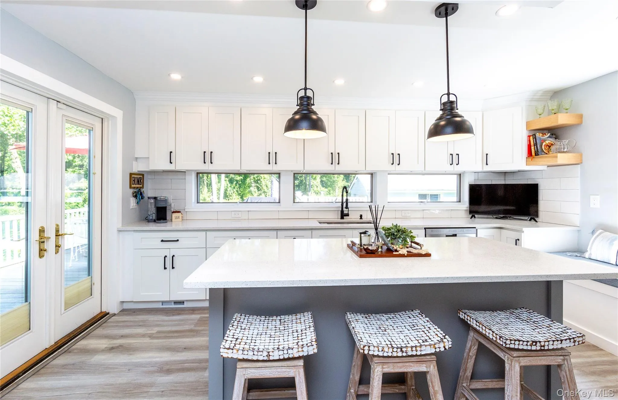 The interior reveals a stylishly renovated kitchen. The interior reveals a stylishly renovated kitchen.