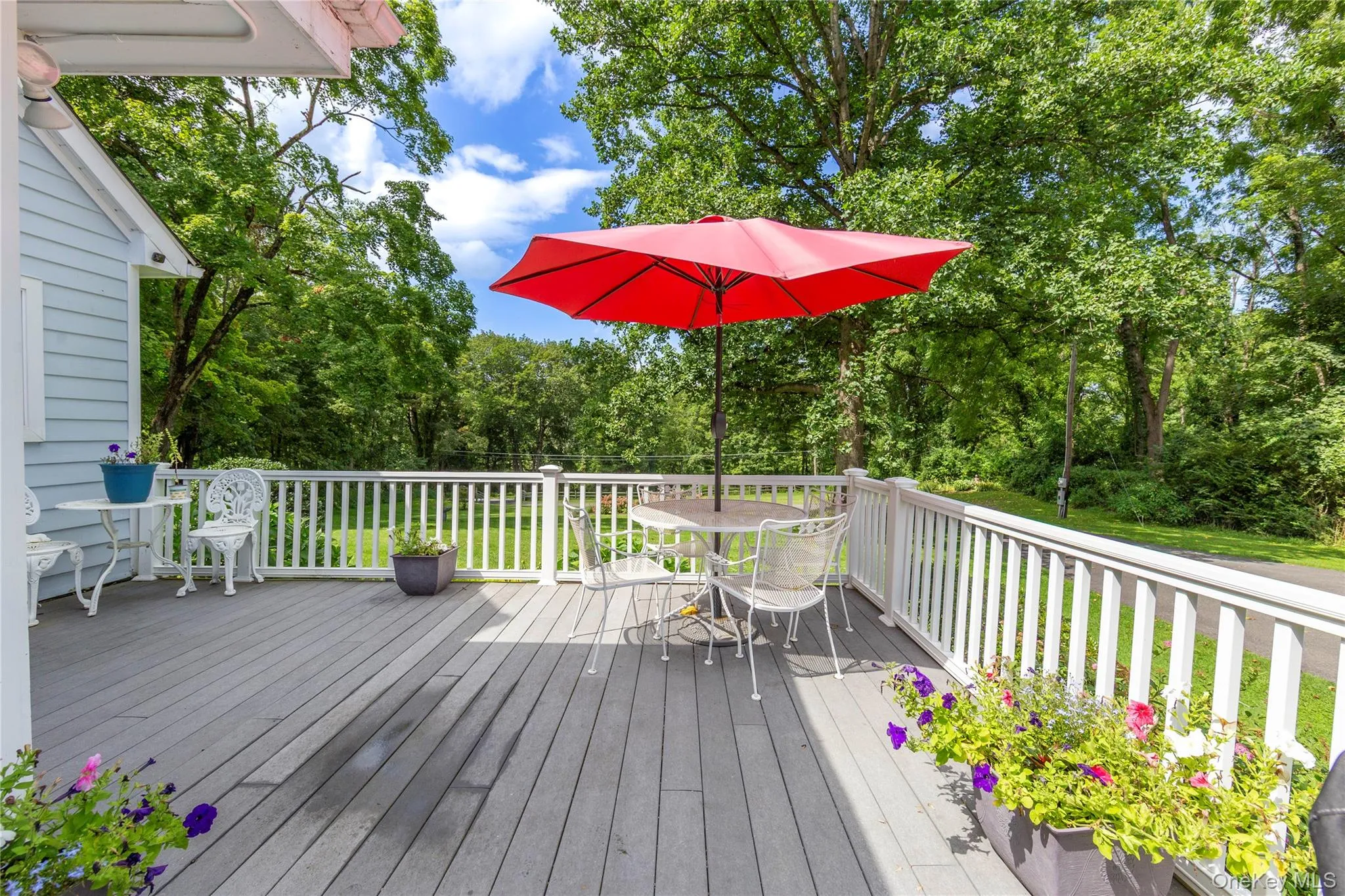 The deck off the kitchen is an inviting spot for morning coffee, al fresco dining, or sunset cocktails. The deck off the kitchen is an inviting spot for morning coffee, al fresco dining, or sunset cocktails.