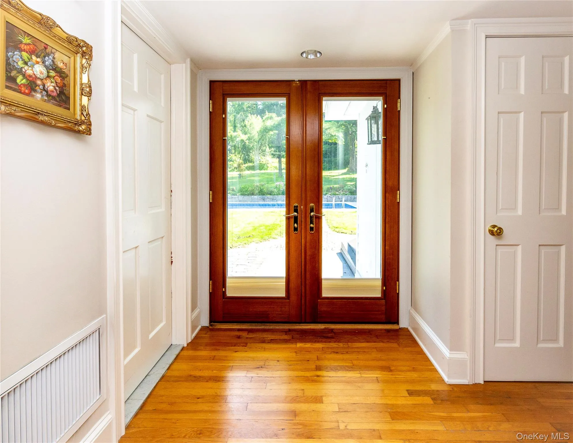 French doors lead to the backyard with pool view. French doors lead to the backyard with pool view.