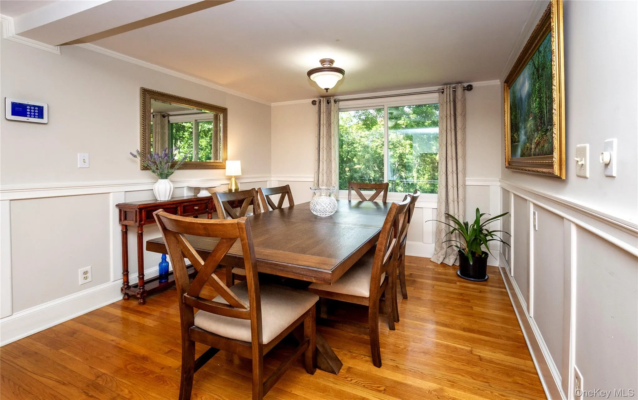 An intimate dining room with large picture window. An intimate dining room with large picture window.