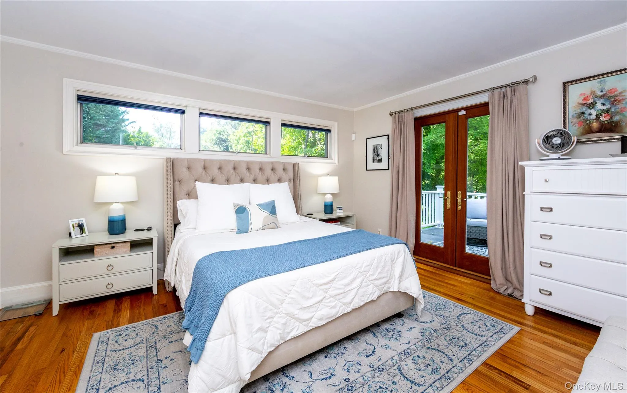 At the end of the hallway, a serene primary suite. At the end of the hallway, a serene primary suite.