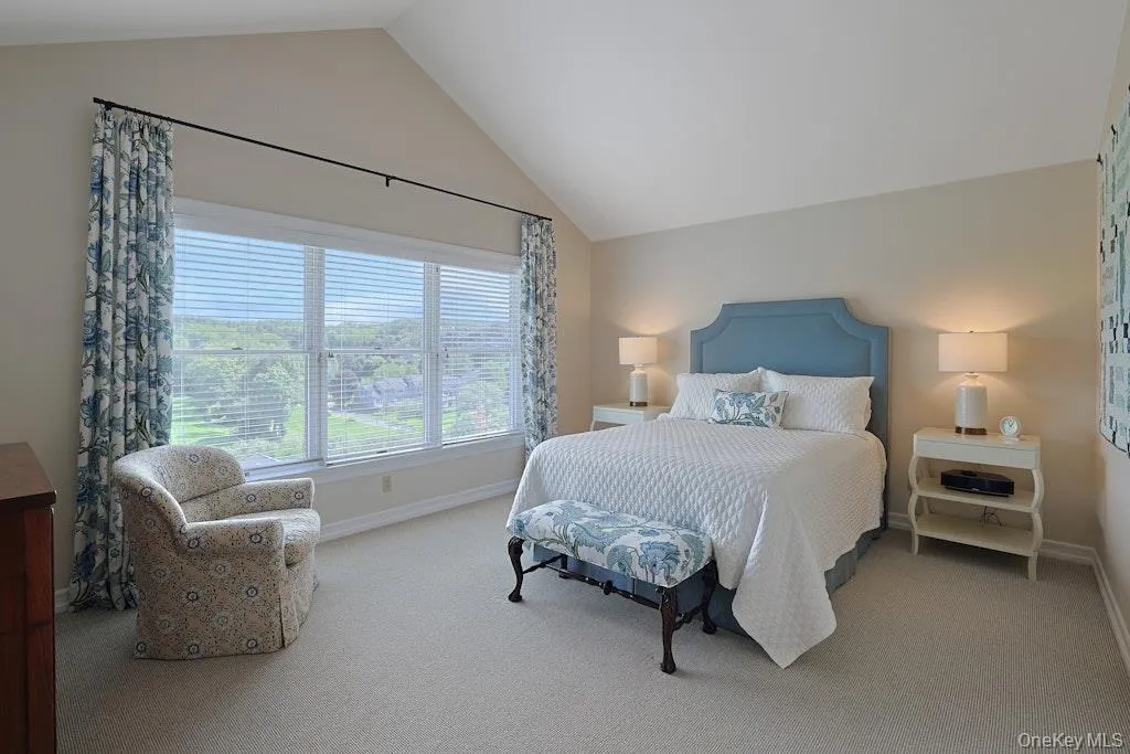 Primary bedroom with vaulted ceilings Primary bedroom with vaulted ceilings