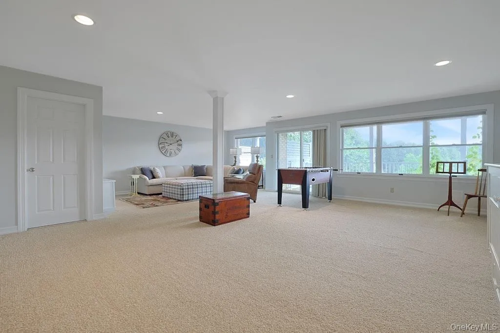 Generously sized recreation room with sliders to the lower level patio Generously sized recreation room with sliders to the lower level patio