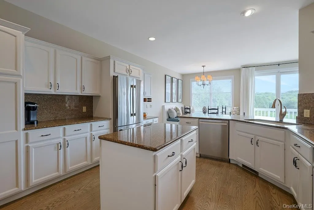 Kitchen island and plenty of counter space and cabinetry for storage Kitchen island and plenty of counter space and cabinetry for storage