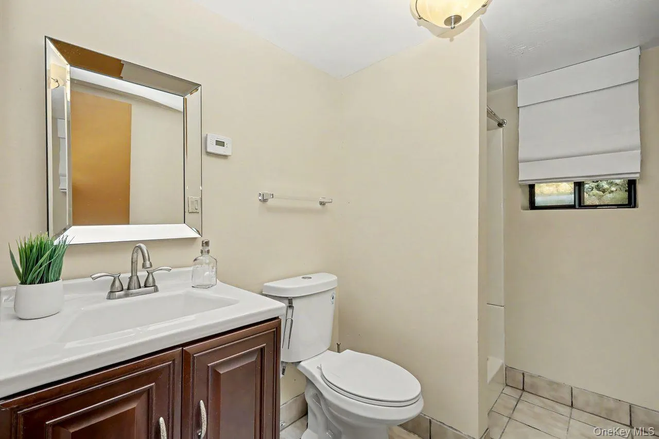 Lower level full bathroom with walk in shower. Lower level full bathroom with walk in shower.