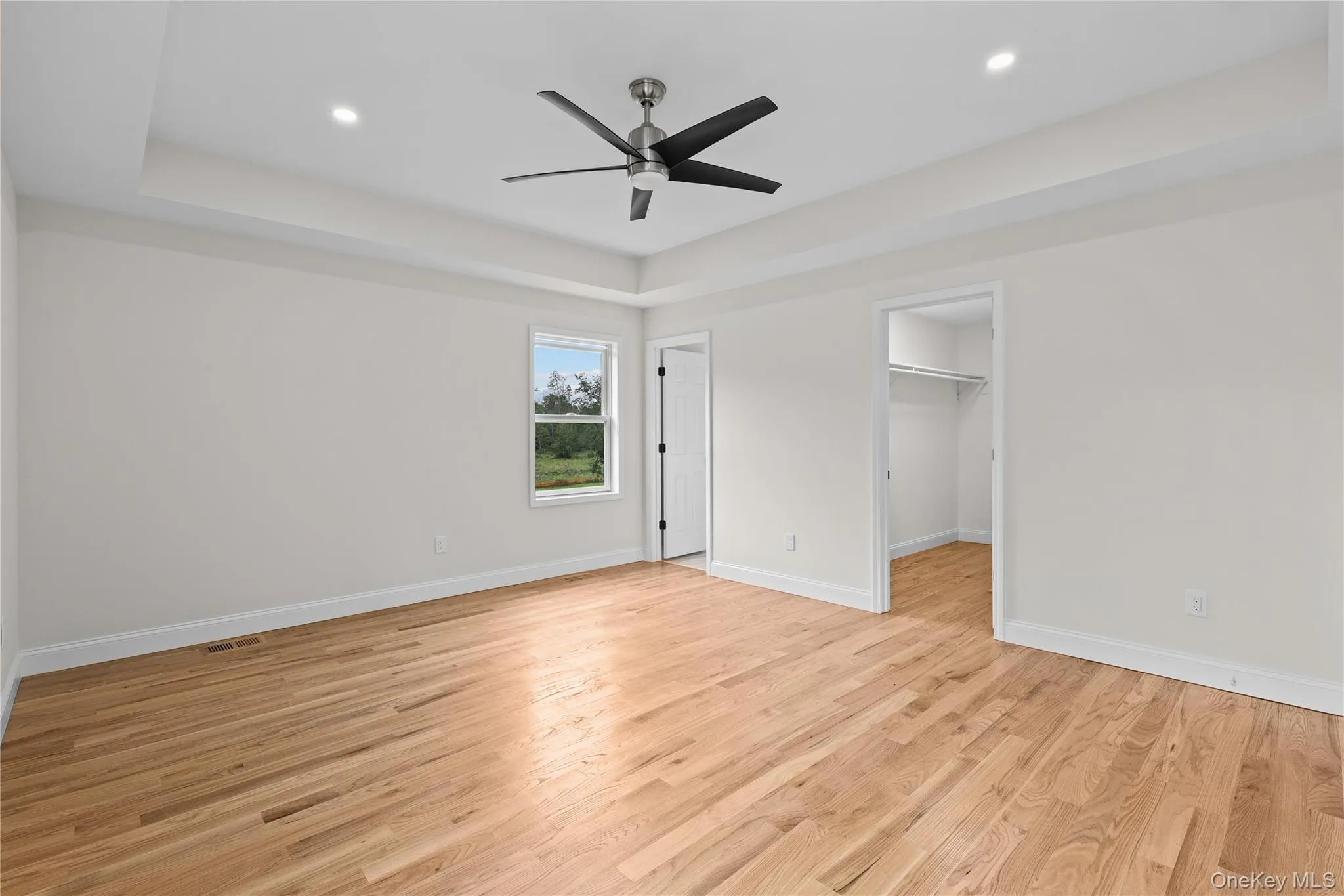 Spacious Primary Bedroom with Tray Ceiling, Private Full Bath & Walk-In Closet Spacious Primary Bedroom with Tray Ceiling, Private Full Bath & Walk-In Closet