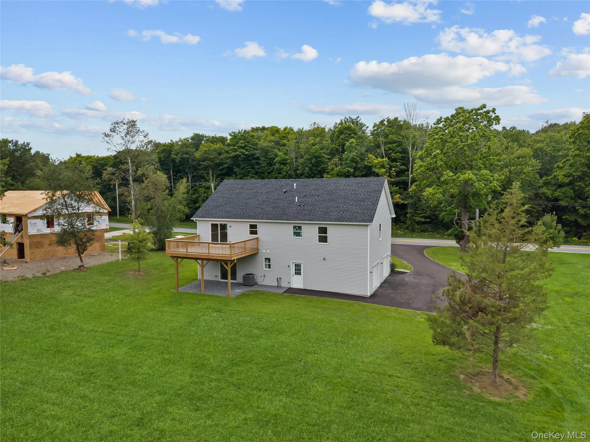 Spacious Backyard with Large Deck – Perfect for Outdoor Living & Entertaining Spacious Backyard with Large Deck – Perfect for Outdoor Living & Entertaining