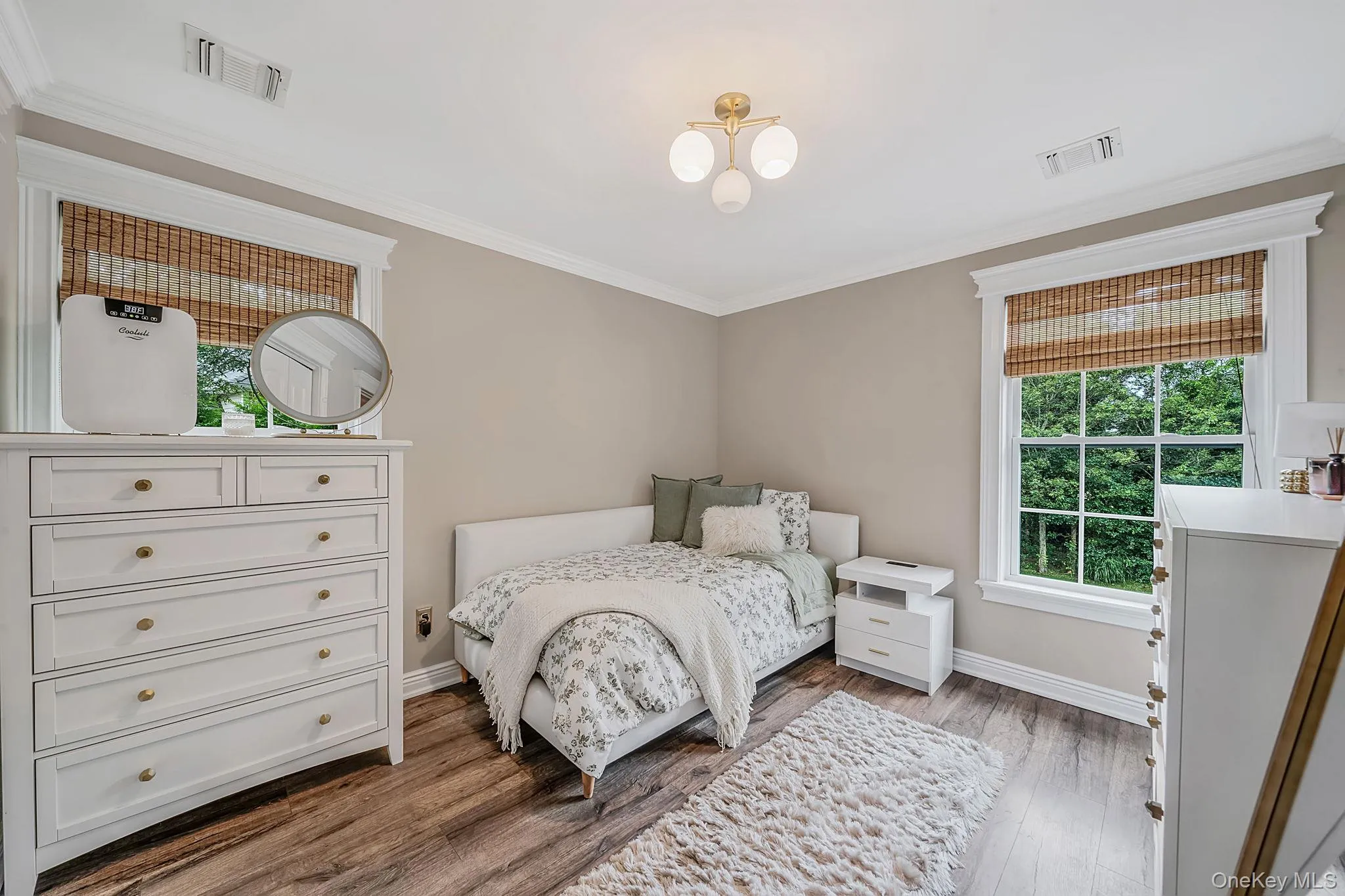 Wood-finish flooring with neutral wall tones and white trim Wood-finish flooring with neutral wall tones and white trim