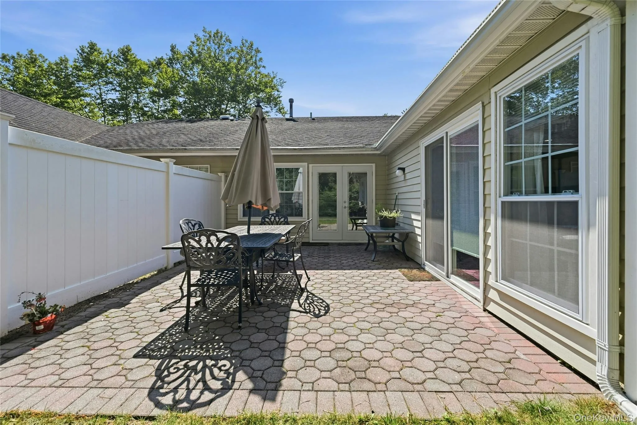 Back Of The Home & The Large Custom Brick/Paver Patio. Back Of The Home & The Large Custom Brick/Paver Patio.