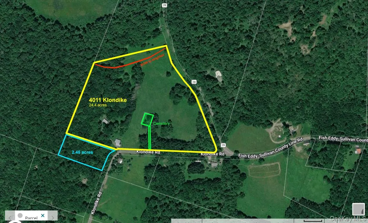 Main 24.4 acres outlined in yellow. Available 2.45-acre lot in blue. Cemetery in green and ROW to neighbor in red. Main 24.4 acres outlined in yellow. Available 2.45-acre lot in blue. Cemetery in green and ROW to neighbor in red.